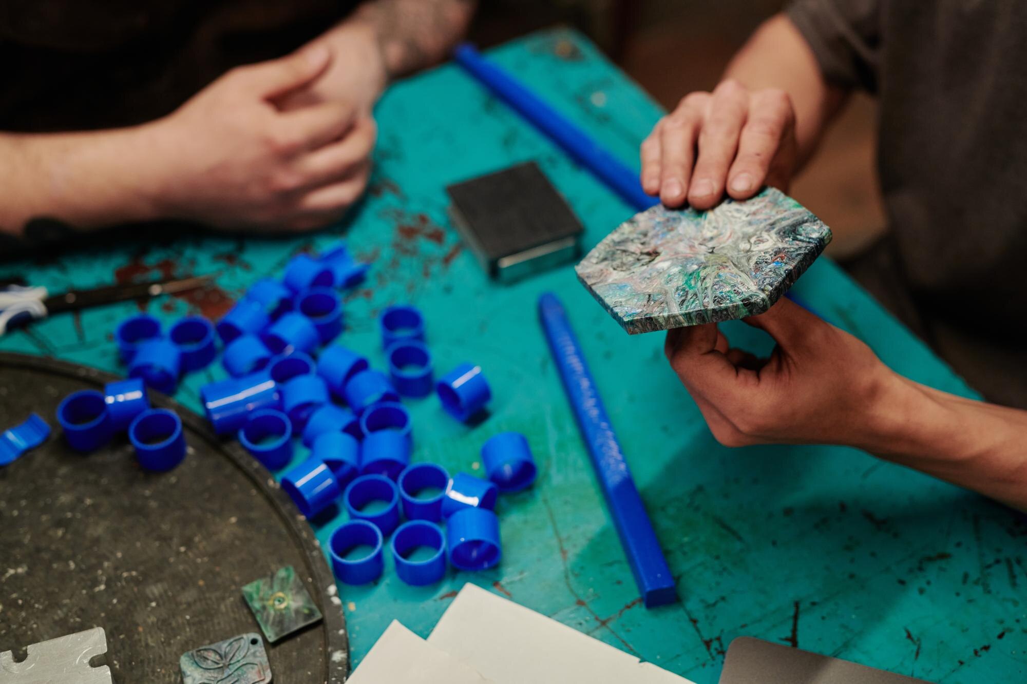 Cut Waste, Cut Costs: Tailored Plastic Solutions for Trade and DIY 2 male worker holding reclaimed tile f800b231e1f2feeaafbf