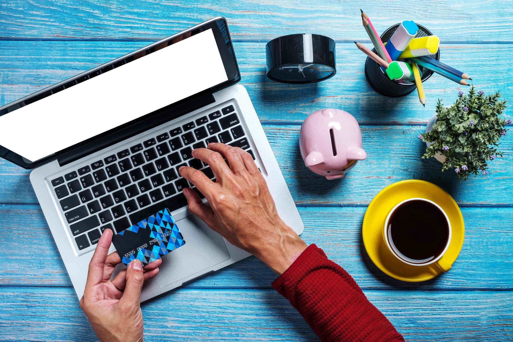 man hand holding credit card and using laptop on d 267b7c3796ed03b8a0c9