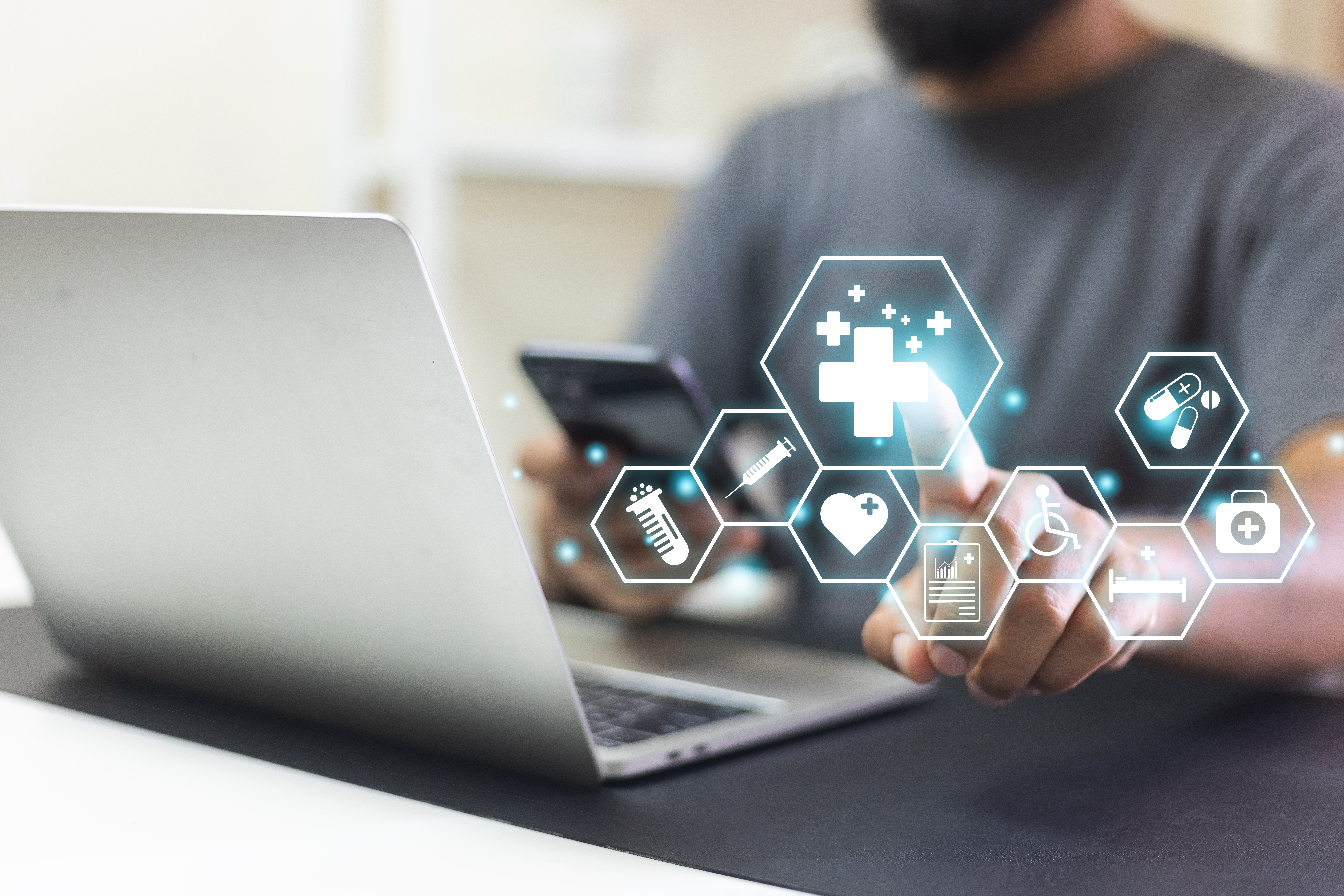 man pointing with medical icons using laptop b3d0177e14515d088ba4 - MedWell Digital Marketing Agency