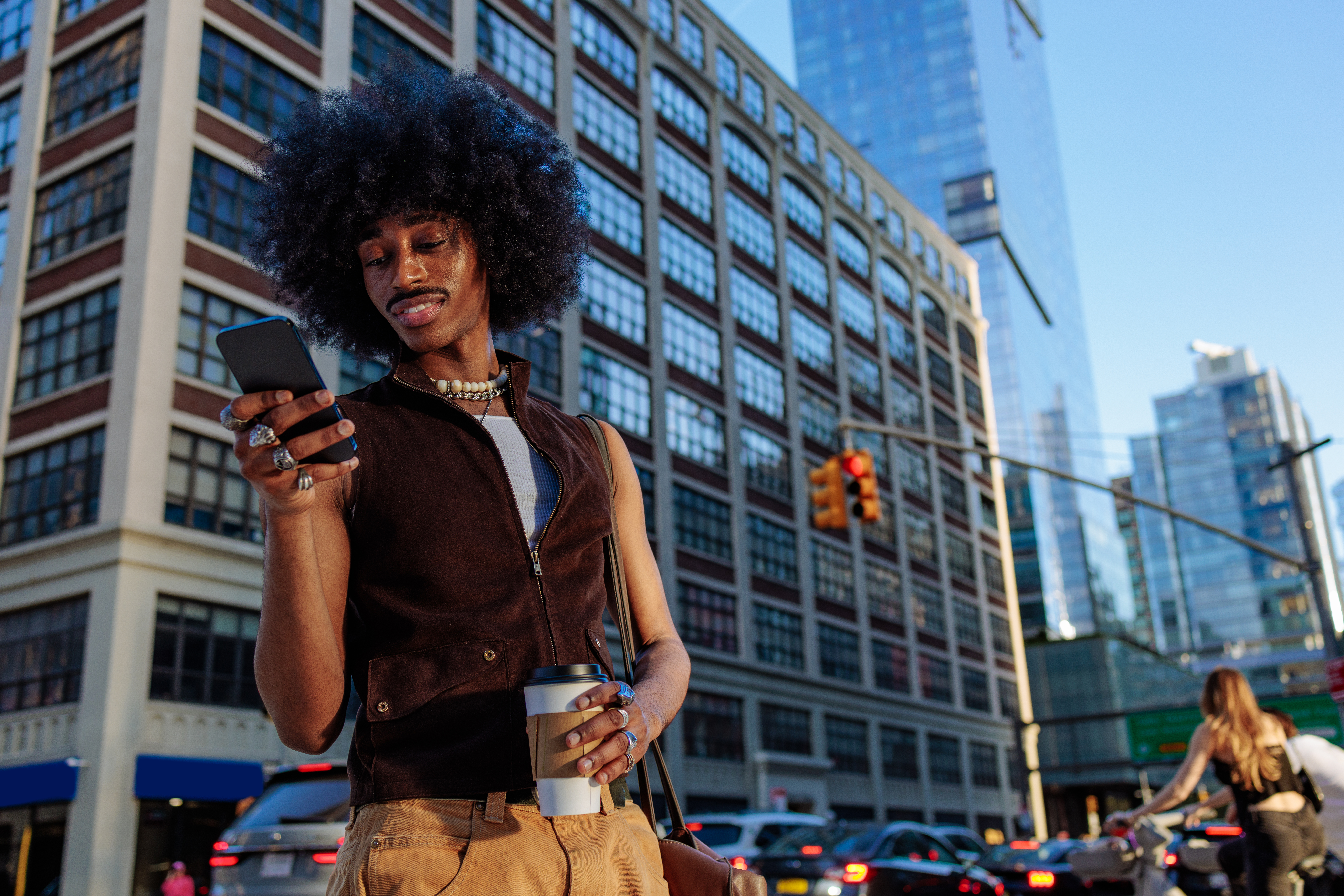 man with afro texting in the city 6d9c2c526f449942e29a The Impact of Location-Focused Platforms on Service Quality in New York's Wellness Industry
