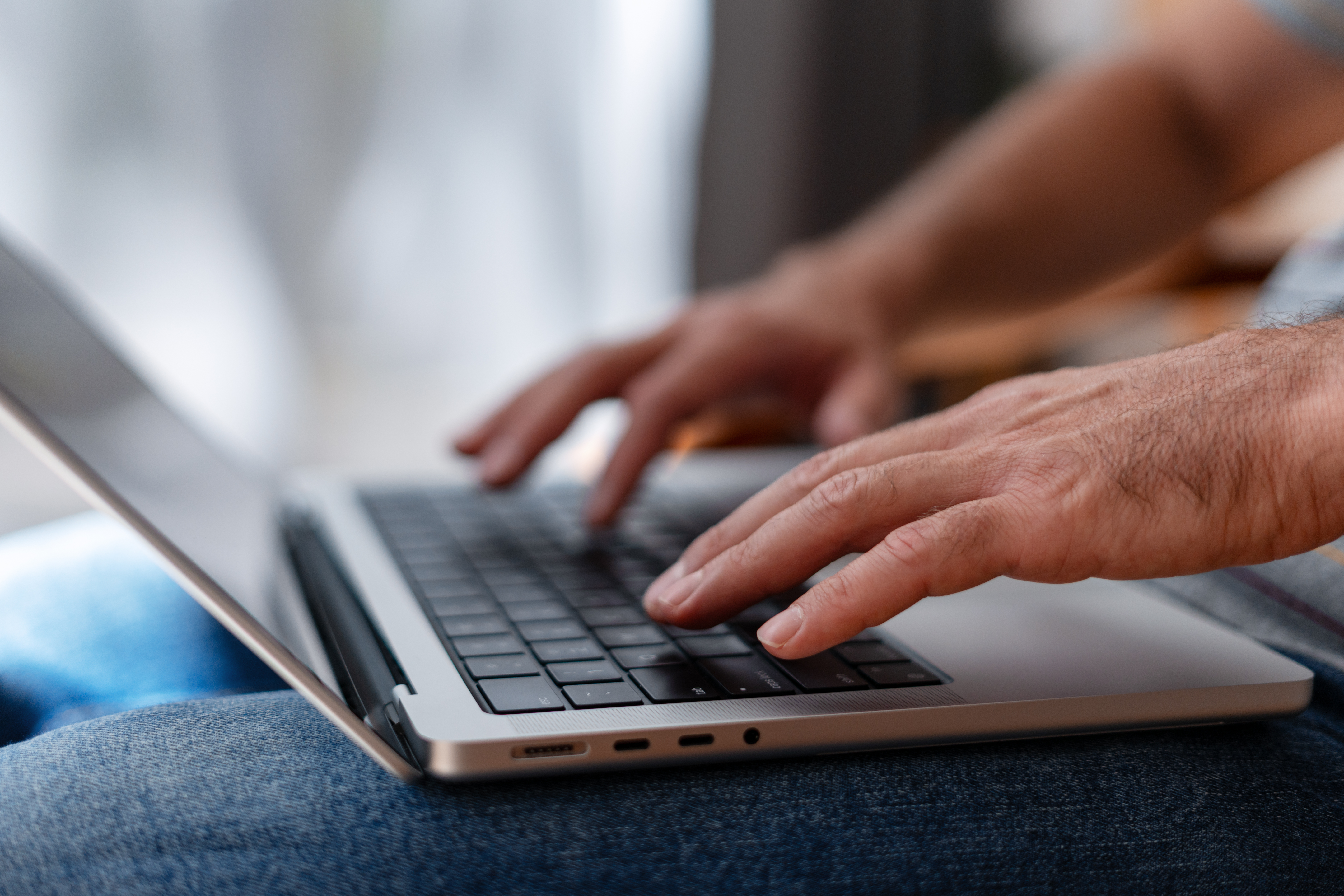 10 simple ways to make your small business website look professional (without breaking the bank) 1 man working from home typing on laptop keyboard 8dd7ec43f2ca74399b20