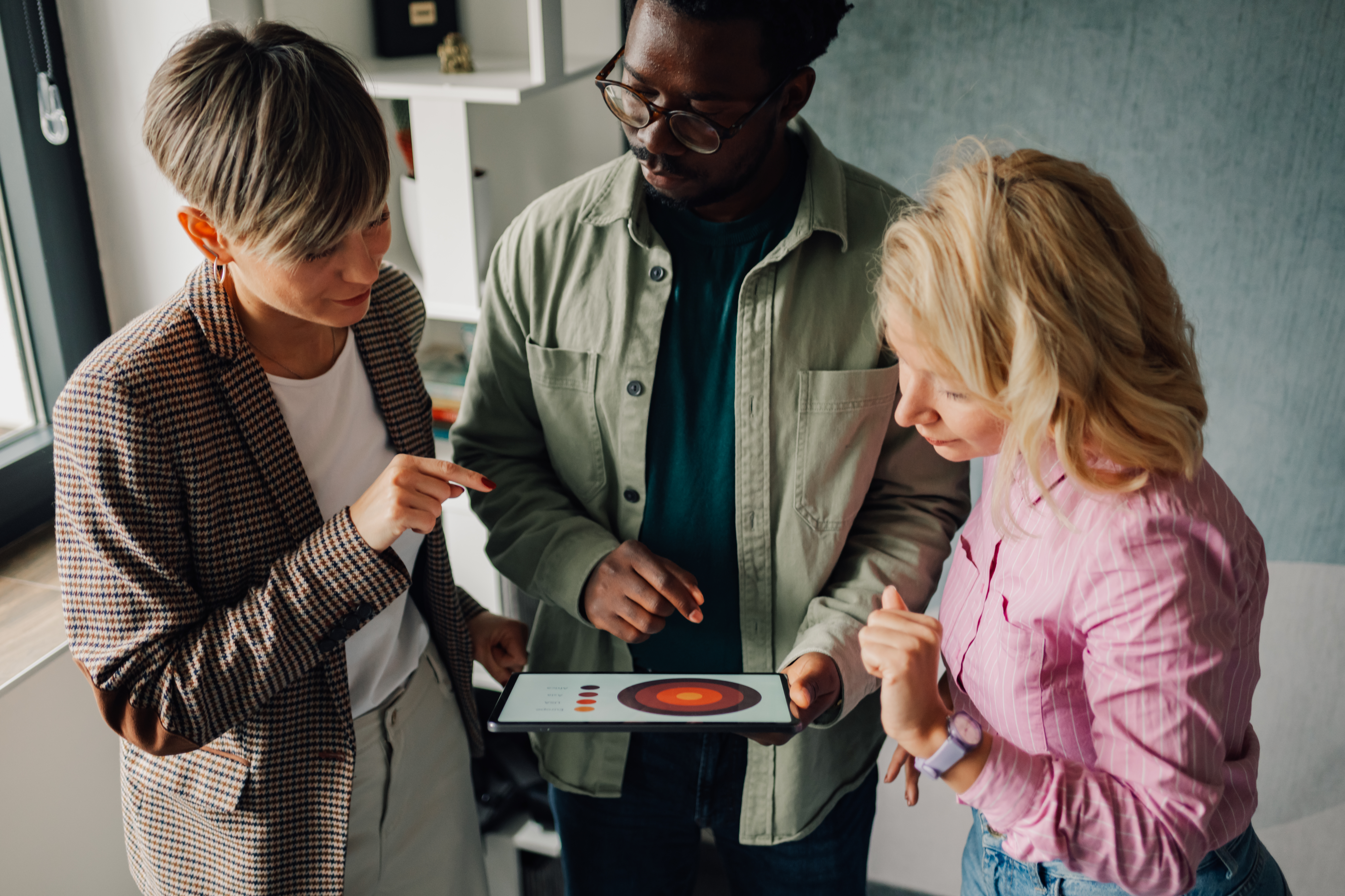 Featured image: Marketing team analyzing charts on digital tablet-4d0a7552f4238e66f057