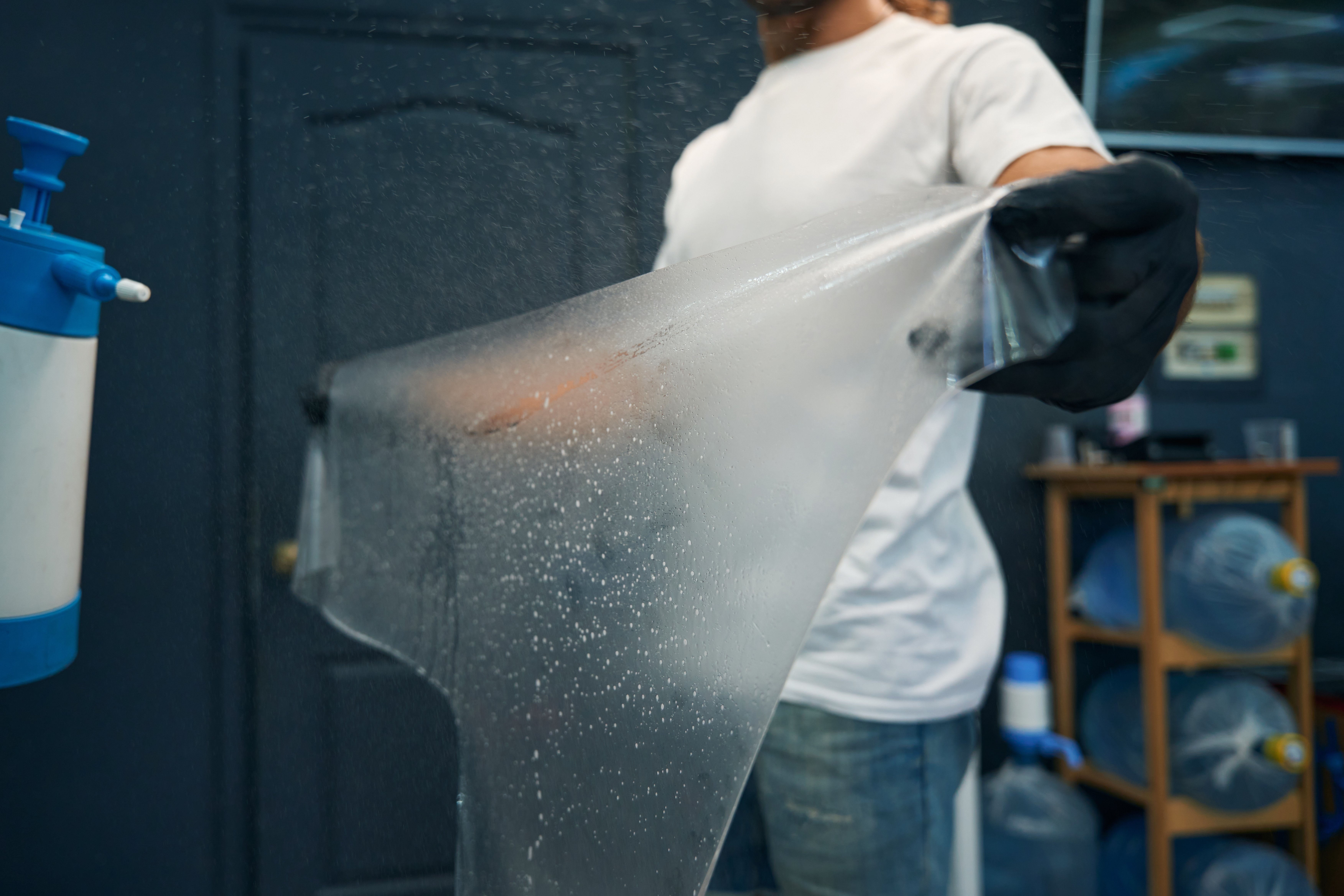 Cheap plastic sheets cost more: The hidden costs in construction and DIY 3 master holds in his hands anti gravel film for glu b13dc027182884e9f5fd