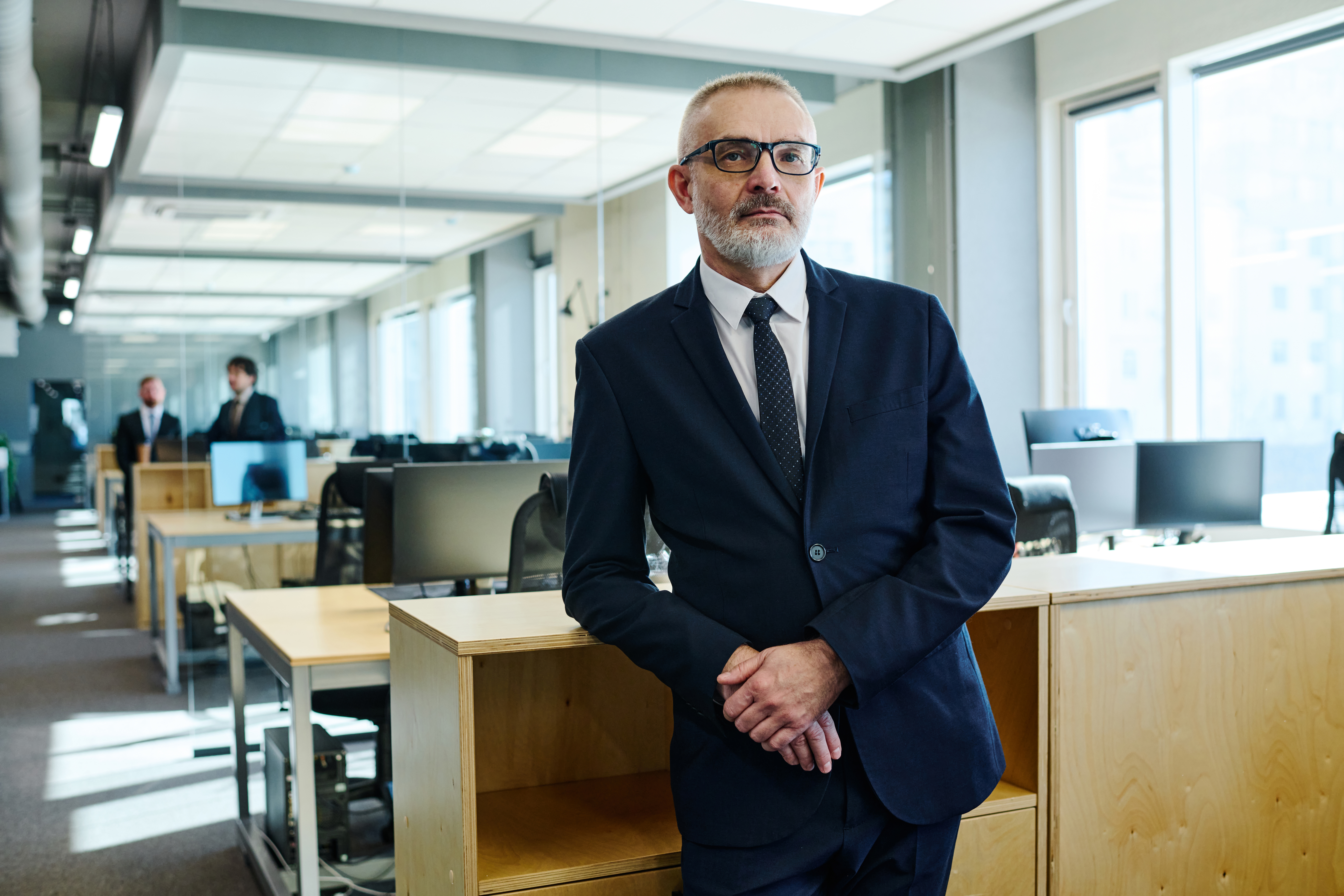 mature businessman in suit at office 57b28bf6e5dfb27a0fc6