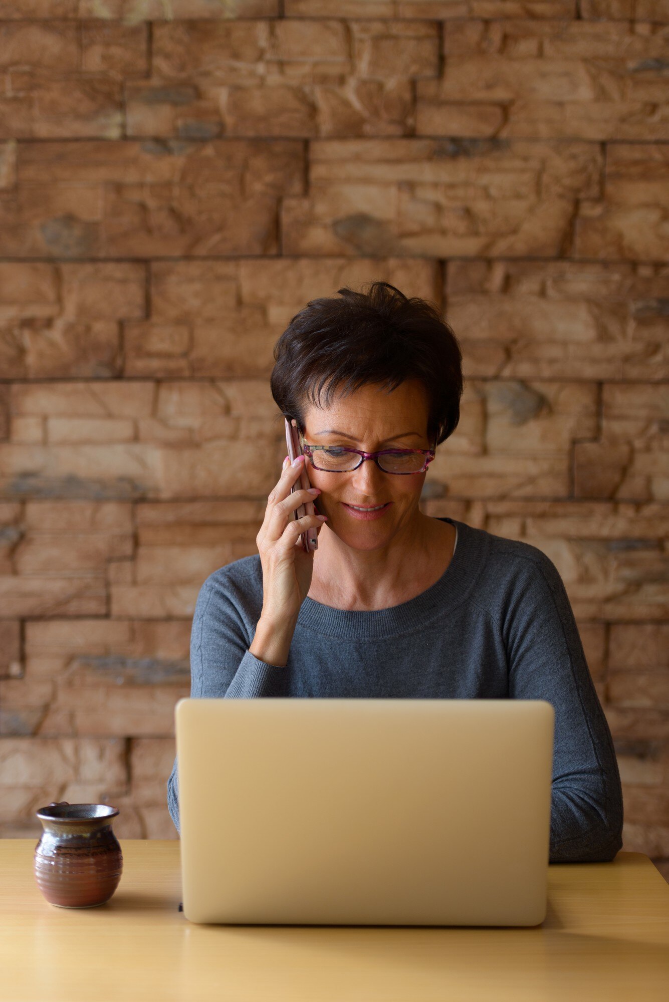 mature happy woman smiling while talking on mobile 0b4c5e20f268b05716de