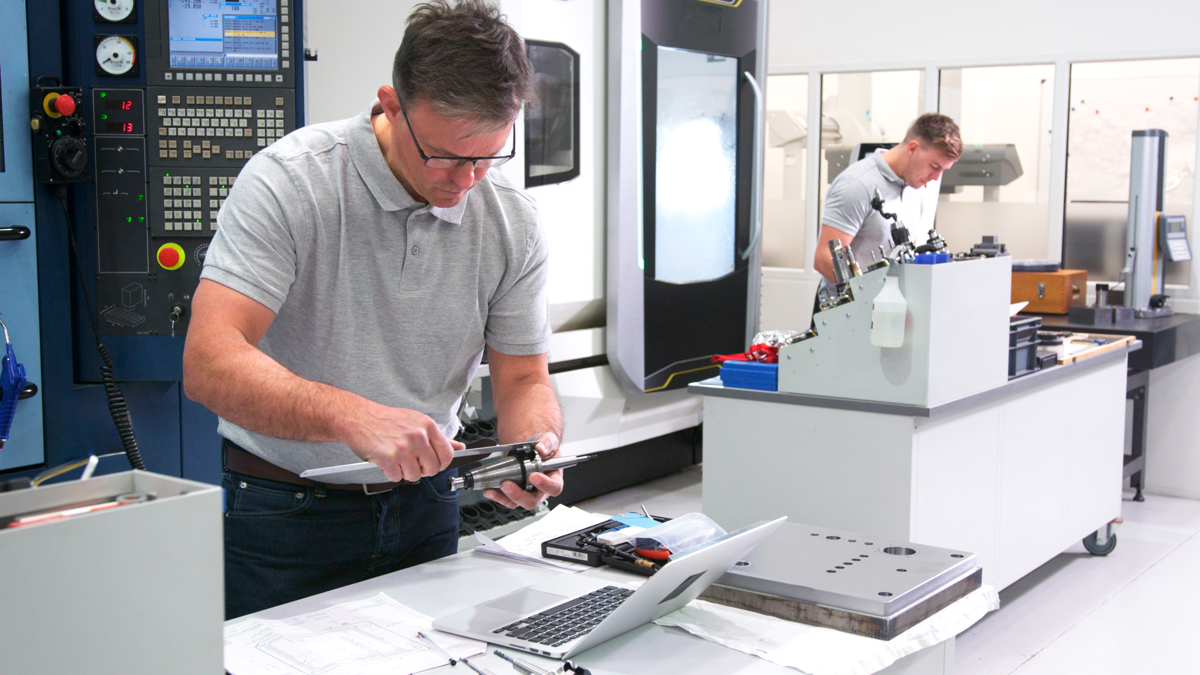 Nail the spec, hit the deadline: How custom plastic fabrication boosts precision and efficiency 1 mature male engineer in factory using cad programm d47bdb753a7eeb30f13e
