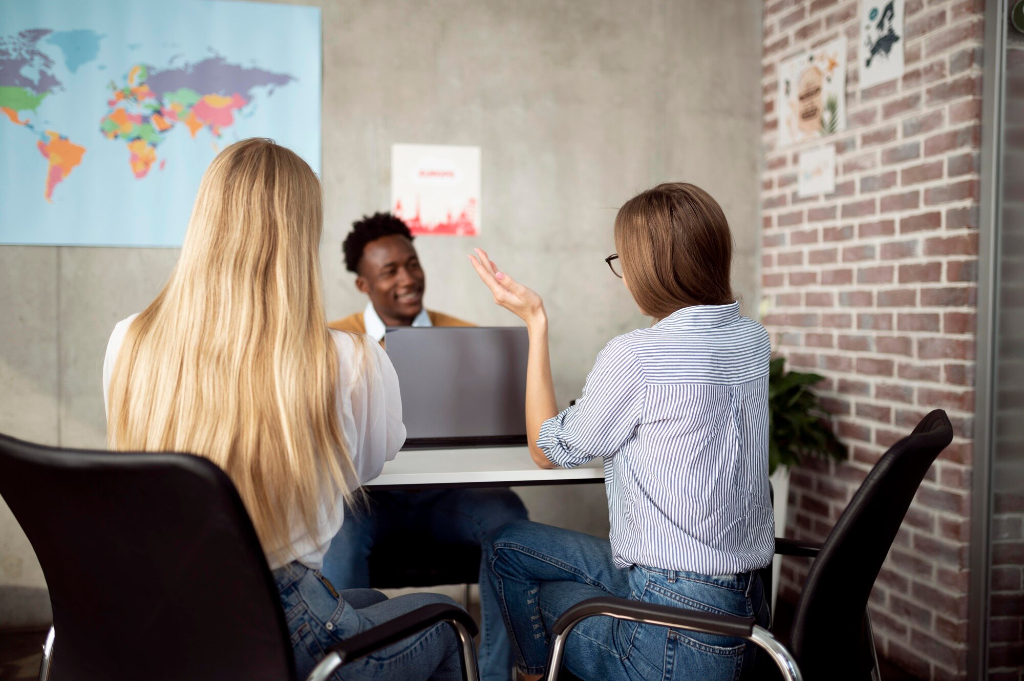medium shot women discussing with travel agent 8193a7e4792ef3d8fee2