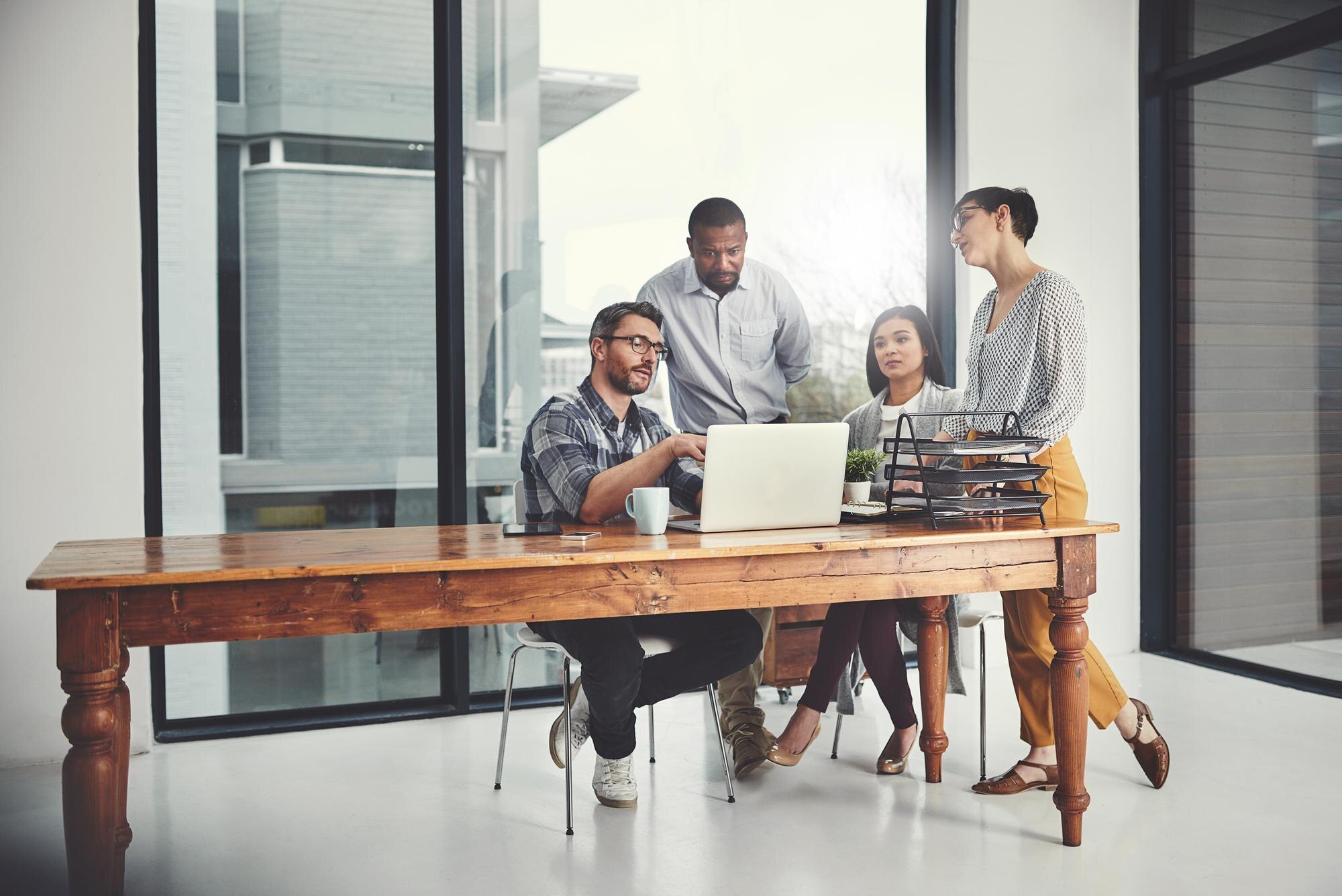 Unlocking the Power of Communication: Strategies for Building a Stronger Workplace 3 mentor laptop and coaching with business people in 5a02c8cb3c4ebaee7c7f