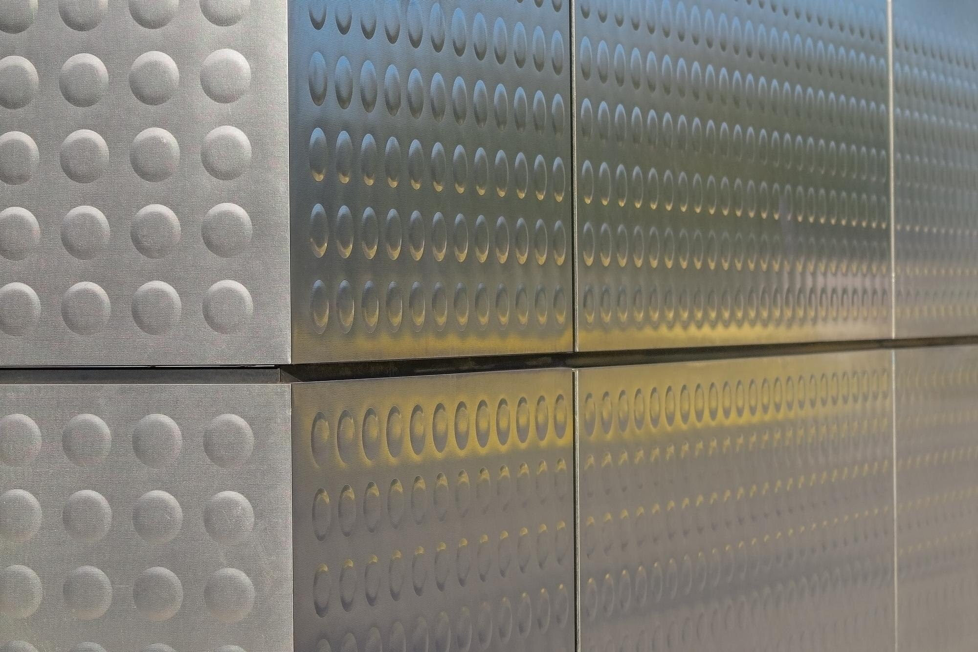 Top Applications for Custom Fabricated Plastics in Trade and Commercial Projects 1 metallic structure with reflections of blue and ye e5b067123e3497c07191