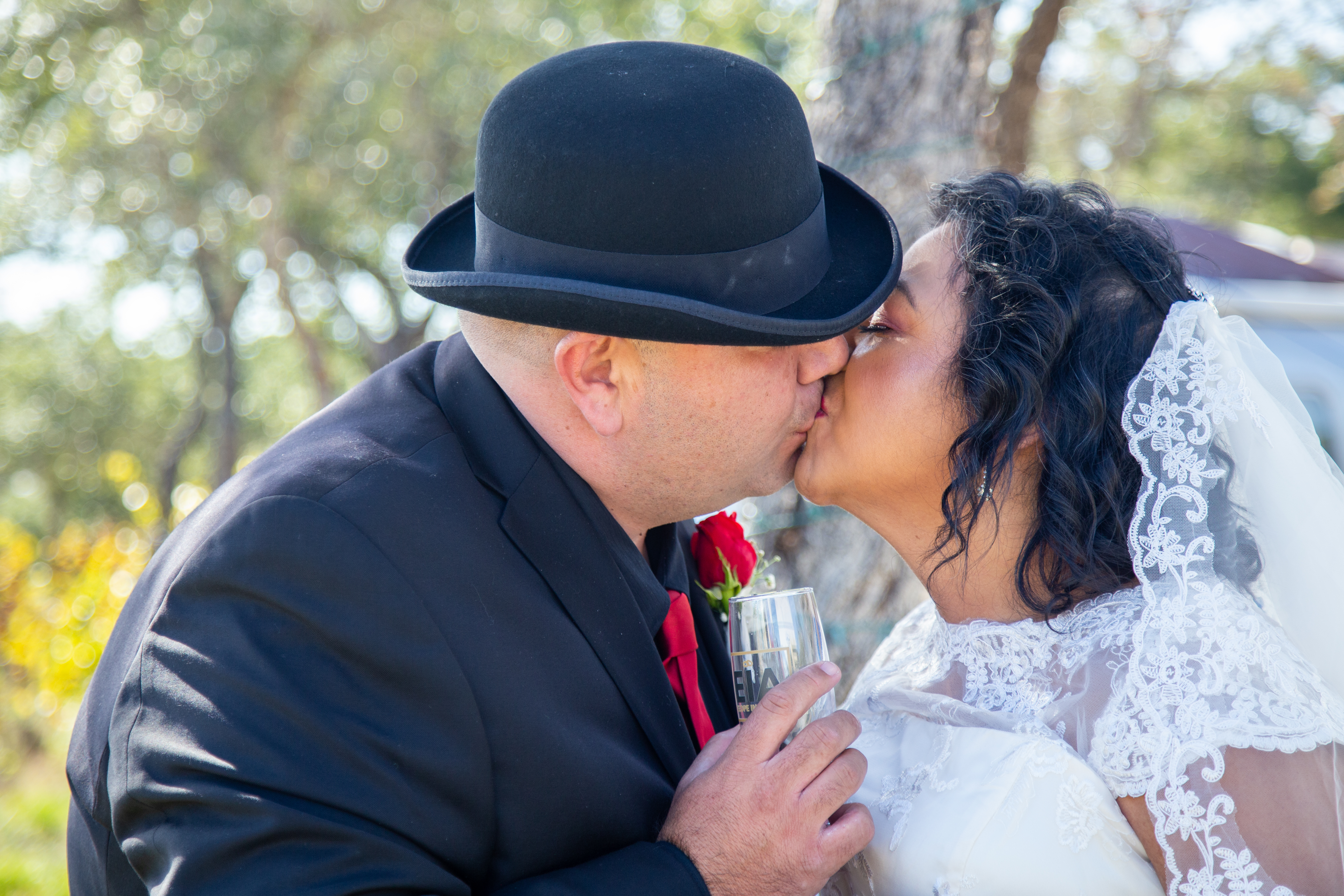 Couple sharing intimate moment at outdoor wedding ceremony