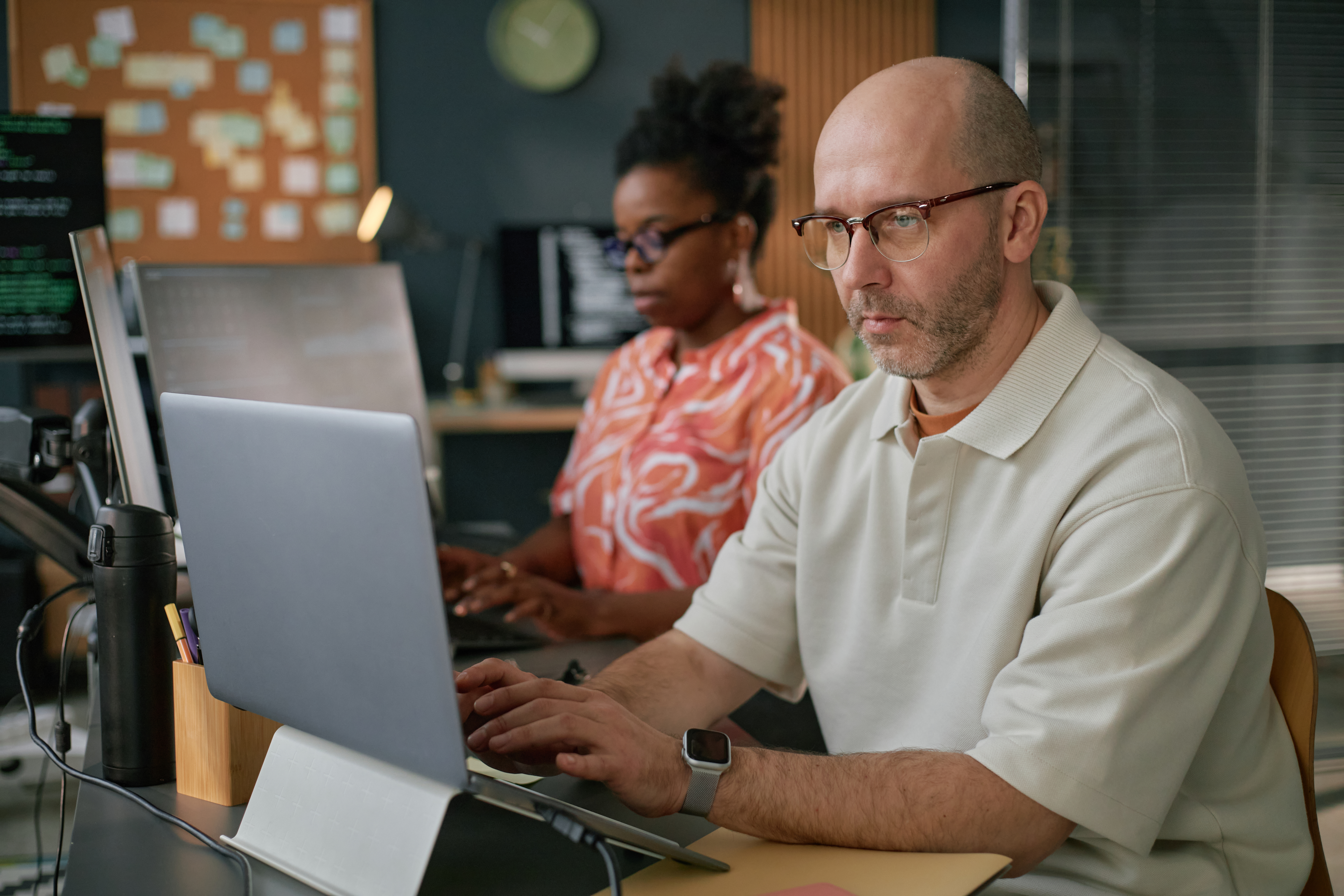 middle aged caucasian man and black woman using of fdbda62923d69711fa6a