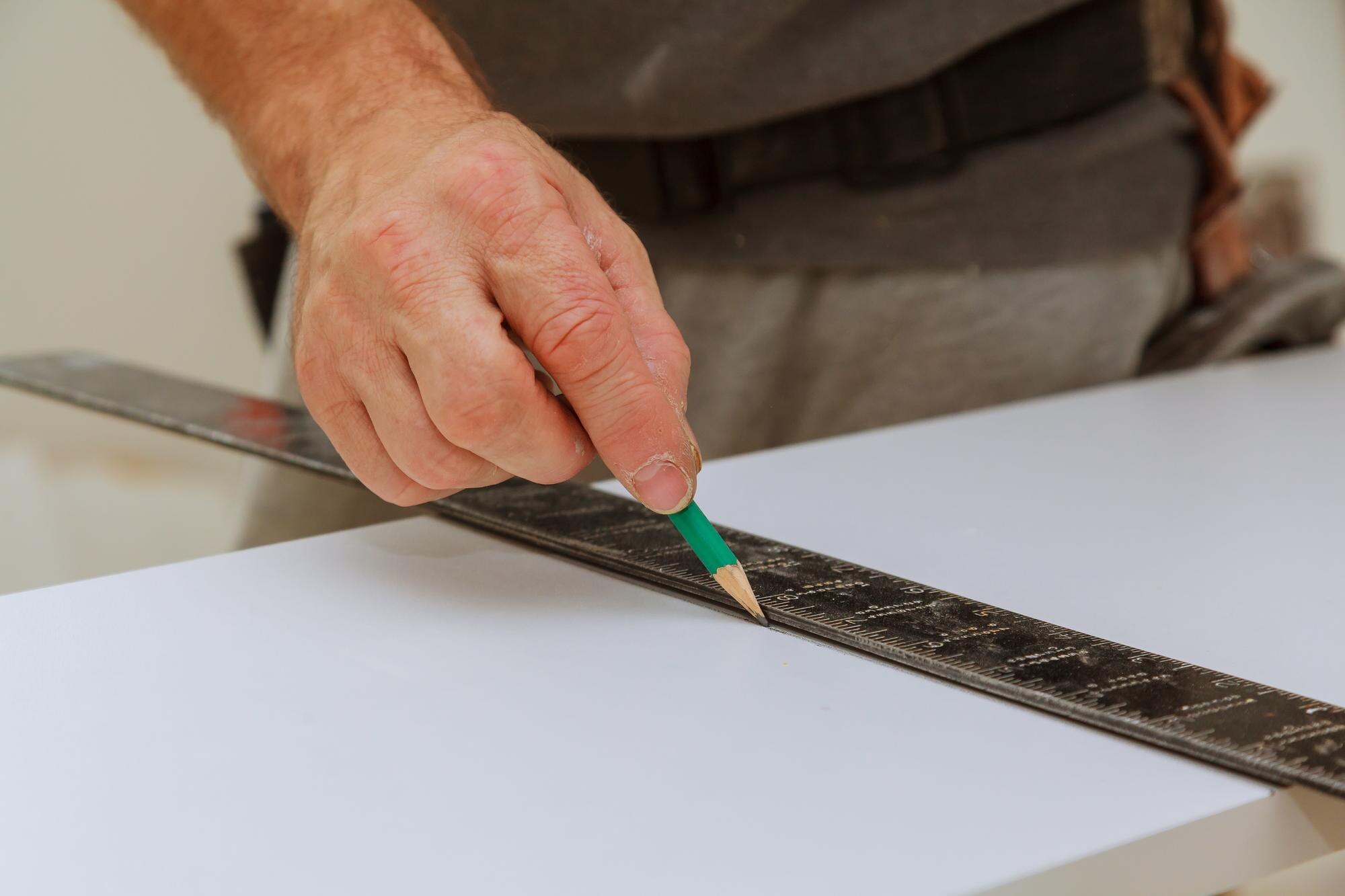 Measure Twice, Order Once: How to Get Cut‑to‑Size Plastic Sheets Spot On 1 midsection of man measuring wood in workshop 0076e17c08b6592ee3ef