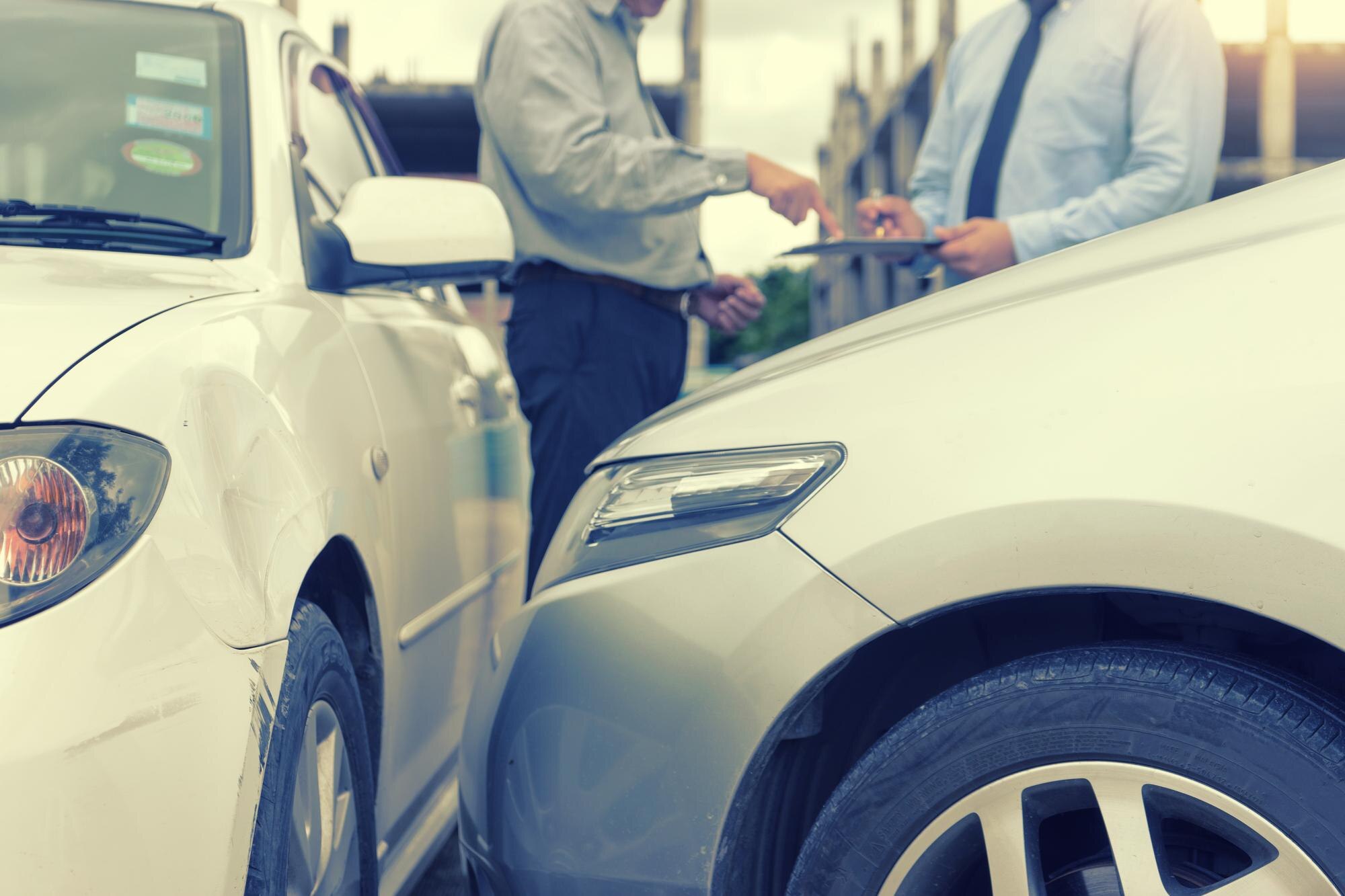 midsection of man signing document by insurance ag bdccd5078f55dcc4963d