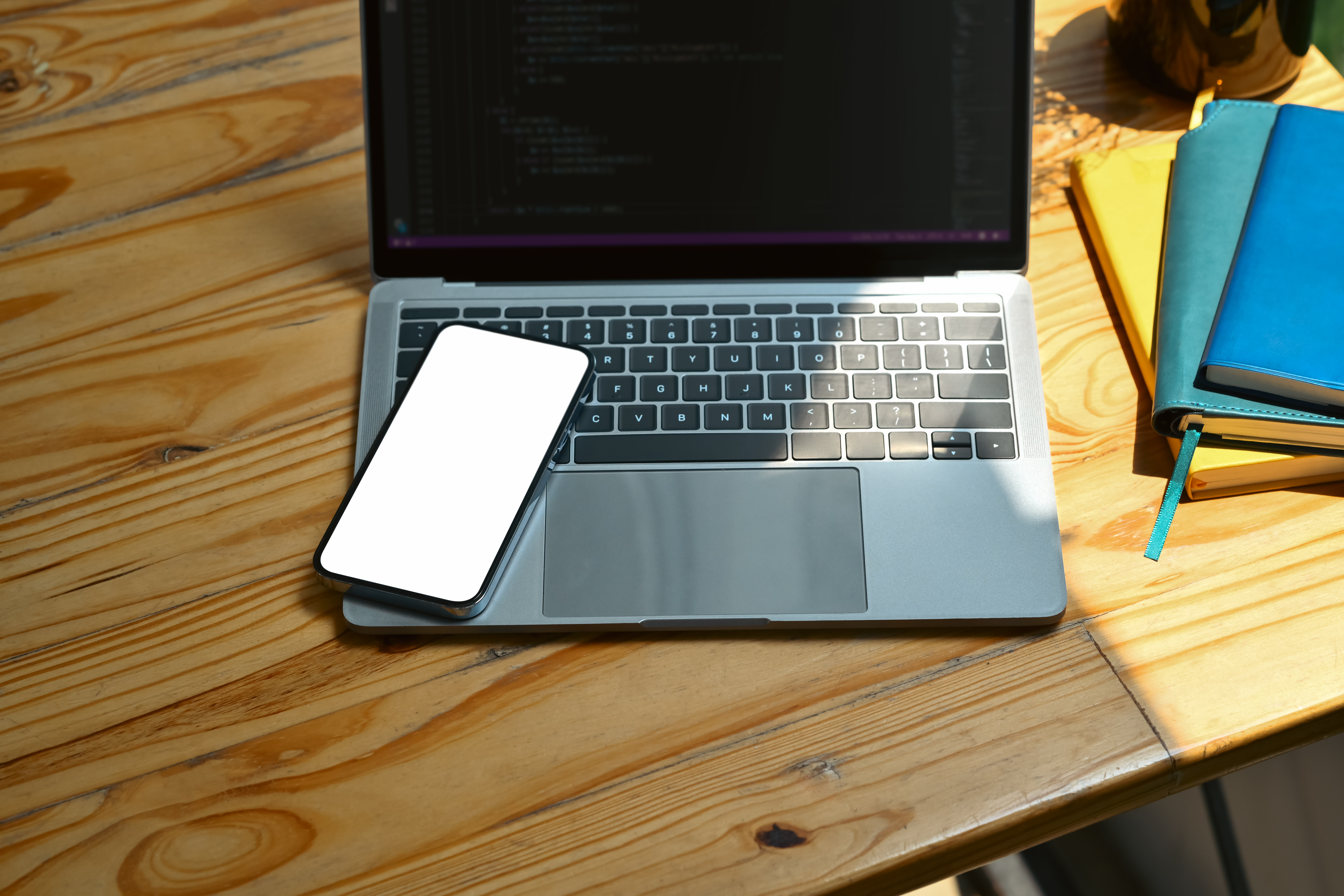 mockup smartphone laptop computer and books on woo 63b15f3d063ce381dc10