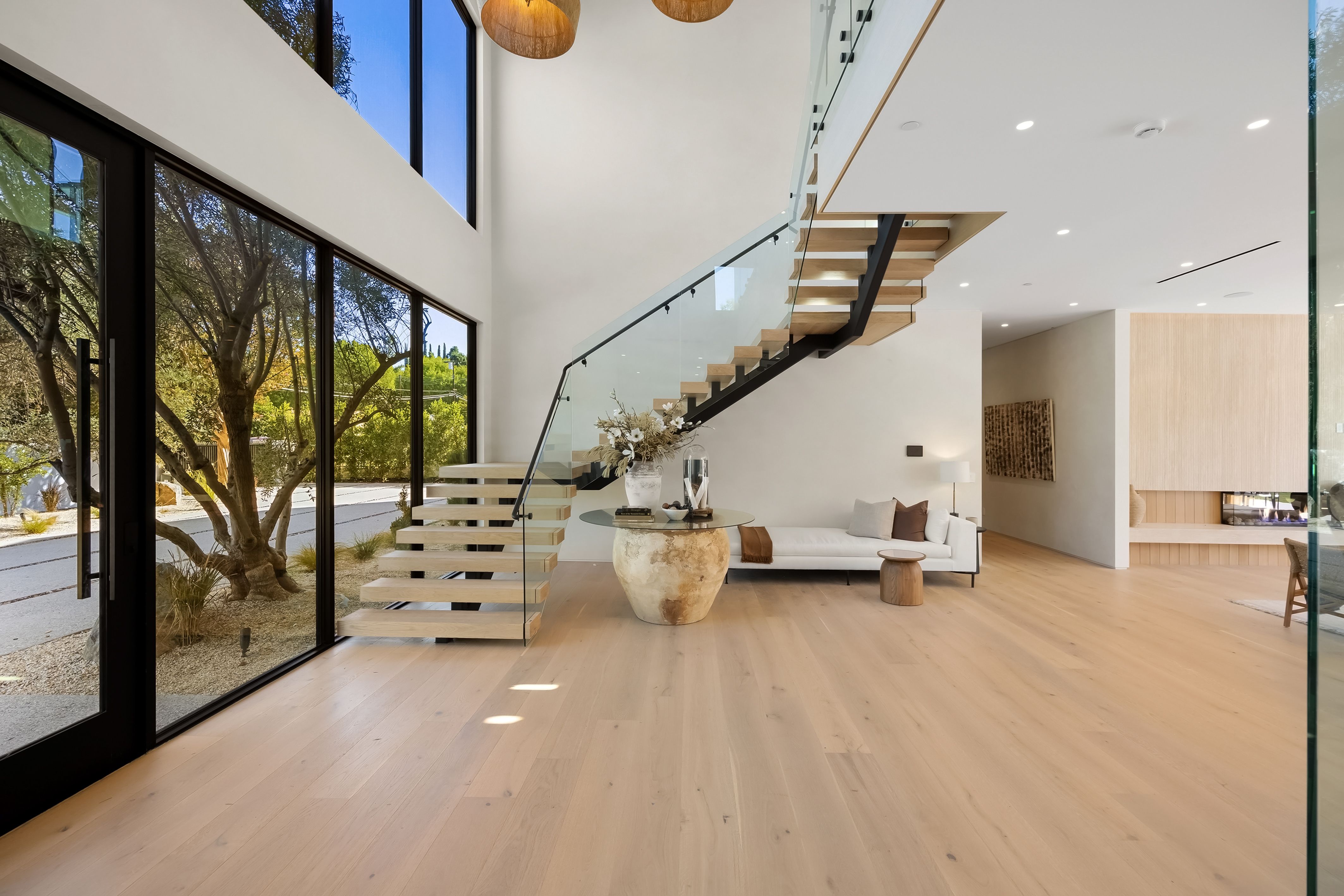 modern interior with open staircase and large wind b8b979d02be74cdb20b6