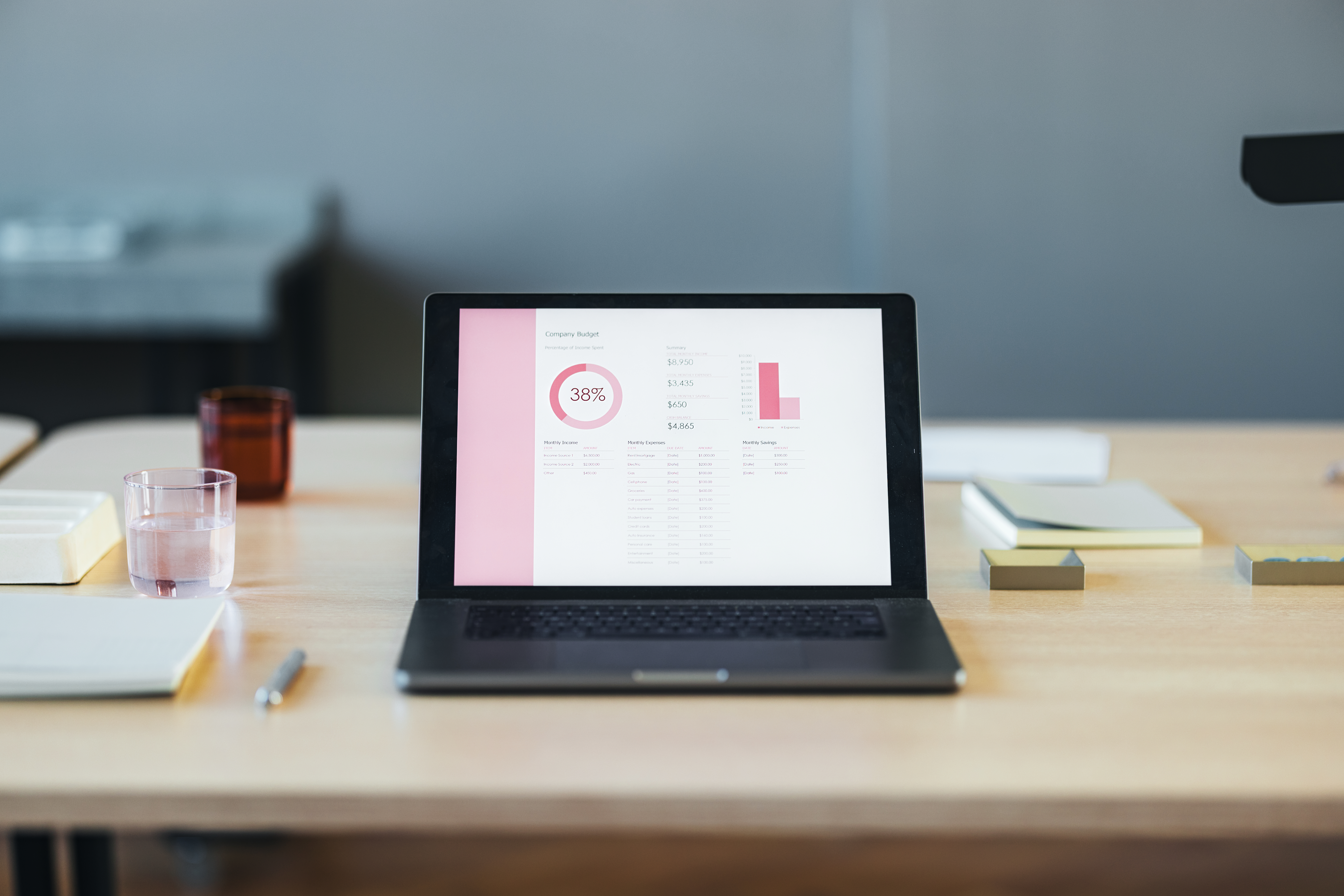 modern office desk with laptop displaying financia 1fed07cb779e0afb11e2