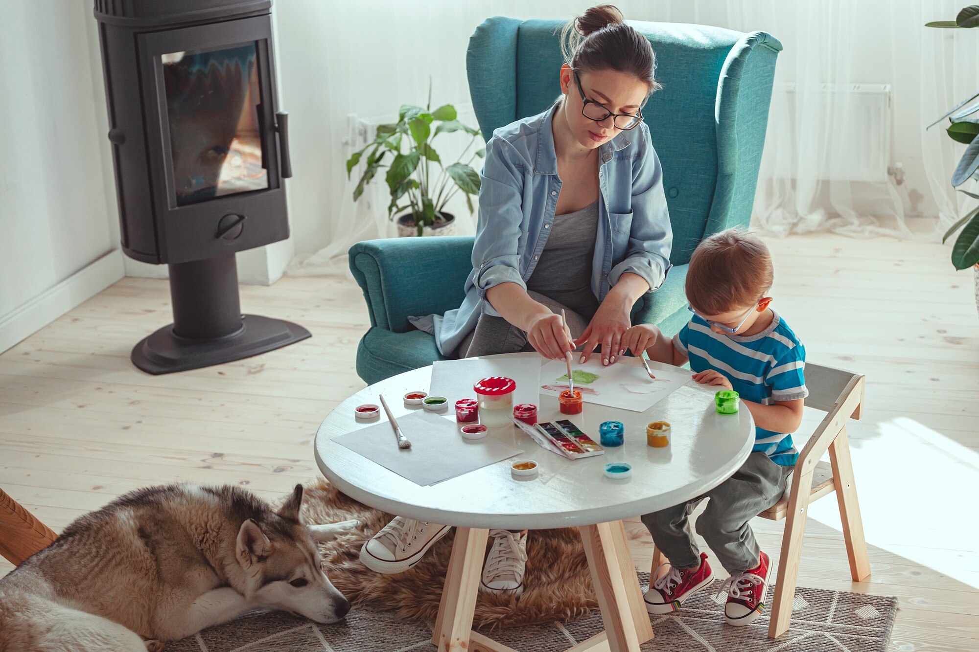 mom and child paint together at home with dog 4f0d3f51fdfa40ff7e0a