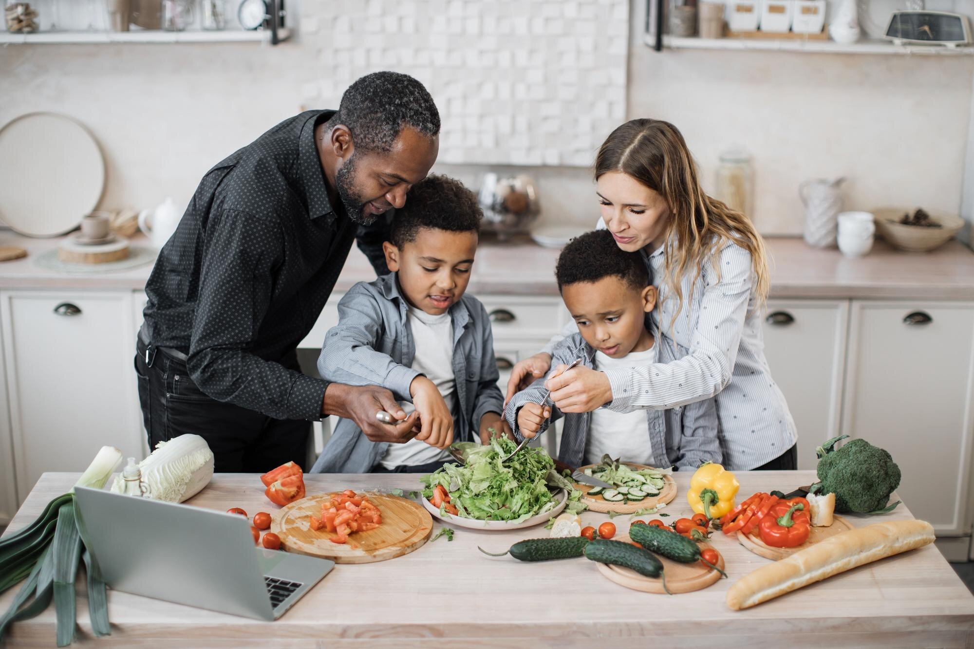 mom and dad sharing salad recipe multiracial famil 80f25cbc5fd86ae5c316