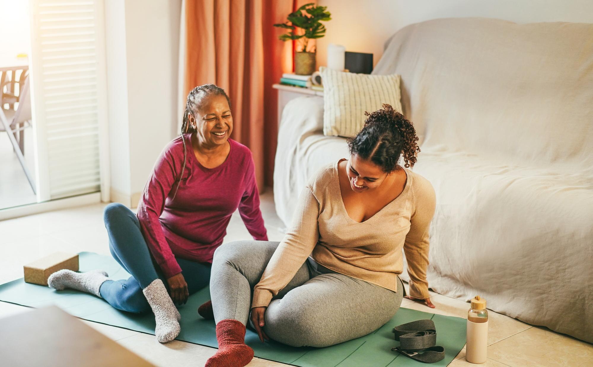 mother and daughter doing fitness exercises at hom 01886d3a9abbeb460809