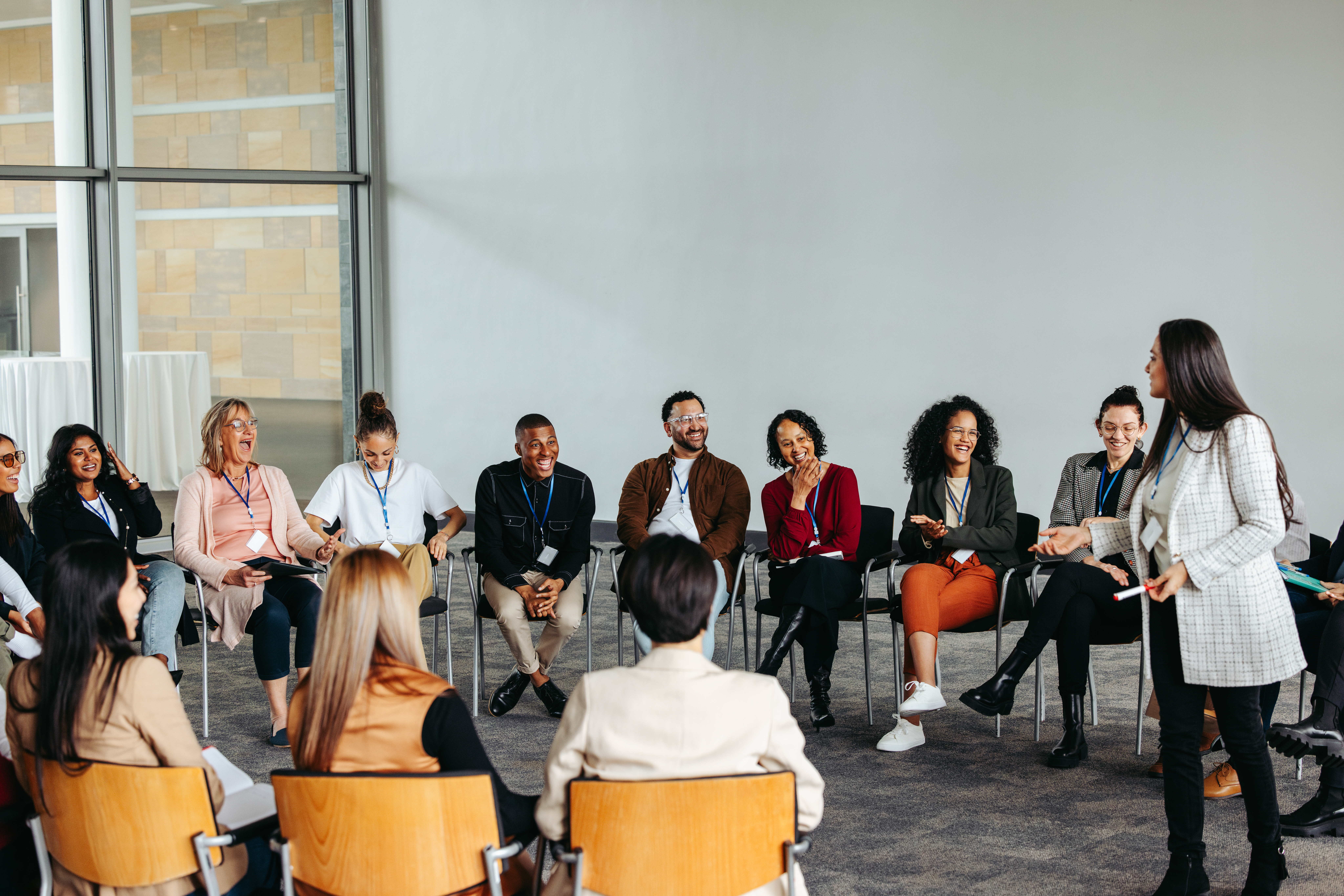 Unmasking AI: Discovering the Unexpected Connection to Our Identity Motivational Speaker Engaging With An Audience In 7a5e598439550fbae642