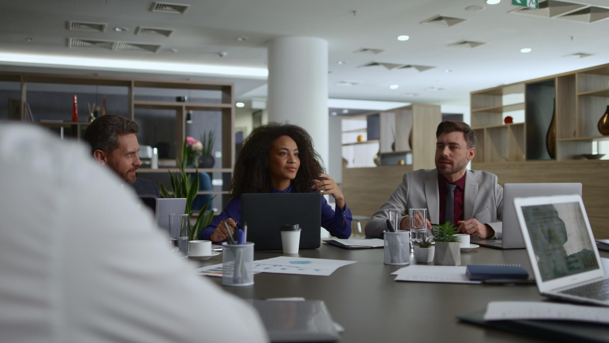 Unlocking the Power of Communication: Strategies for Building a Stronger Workplace 7 multi ethnic financial team meeting researching bu 1265753596e79bea46bd
