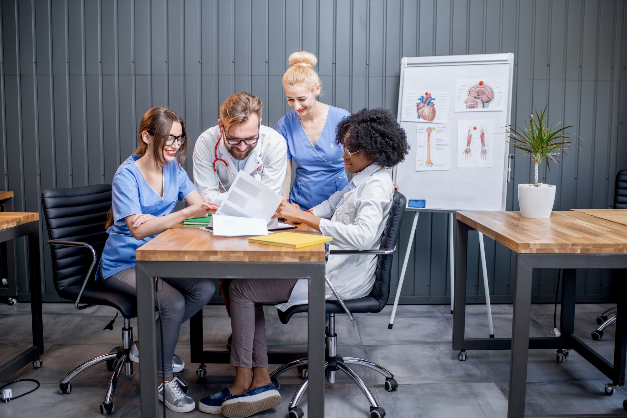 Medical staff discussing ways to overcome management obstacles