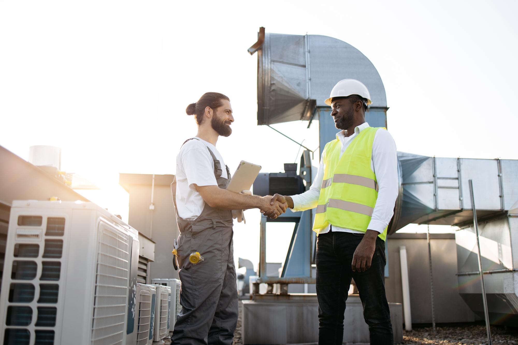 two industrial contractors working on industrial HVAC-R and other industrial systems