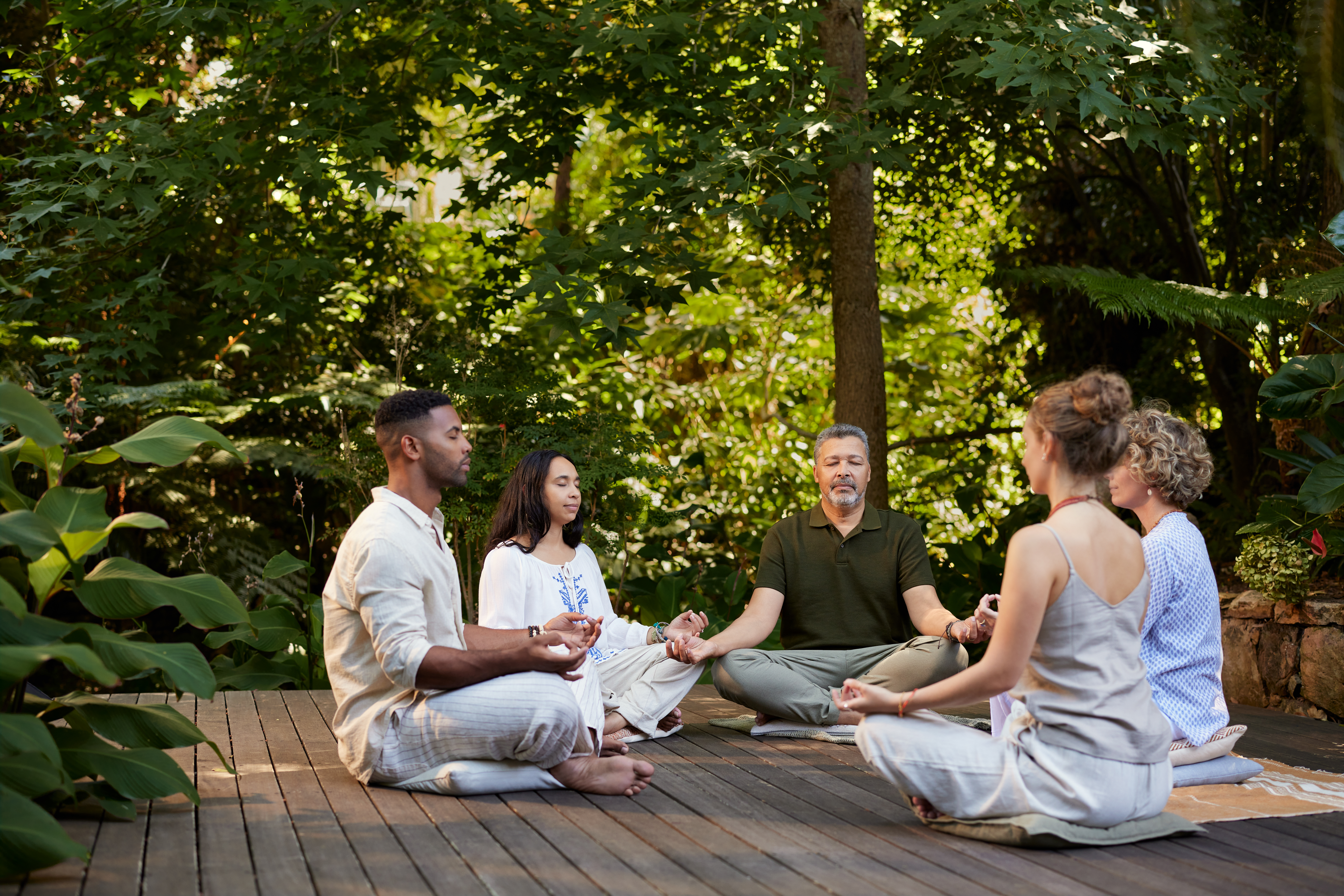 multiethnic group of people meditating outdoor 5b6cca914a8e9e57963b
