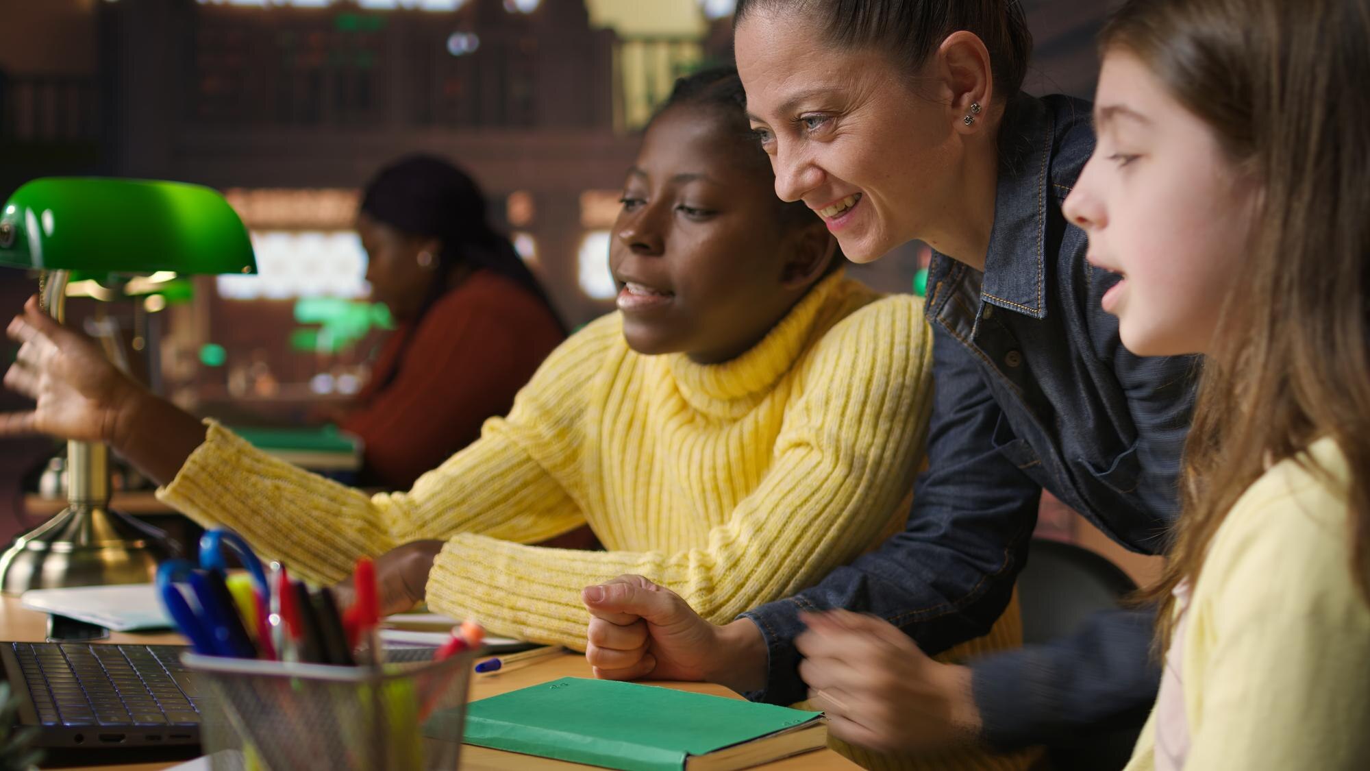 Multiethnic Scholars In The Library Engaged In Rem 5e6022ab7a1492ef637c