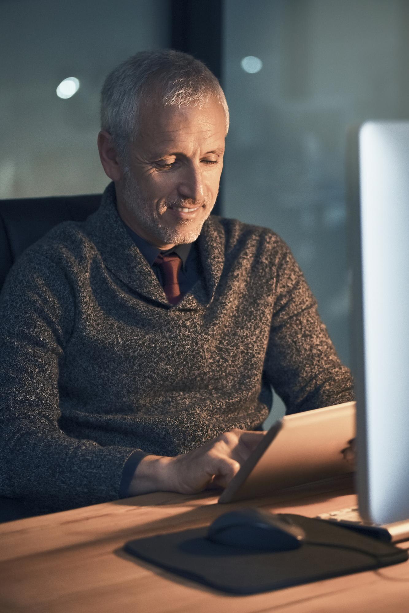 night research and mature man with tablet reading 4201061ec3b34b8fee0c