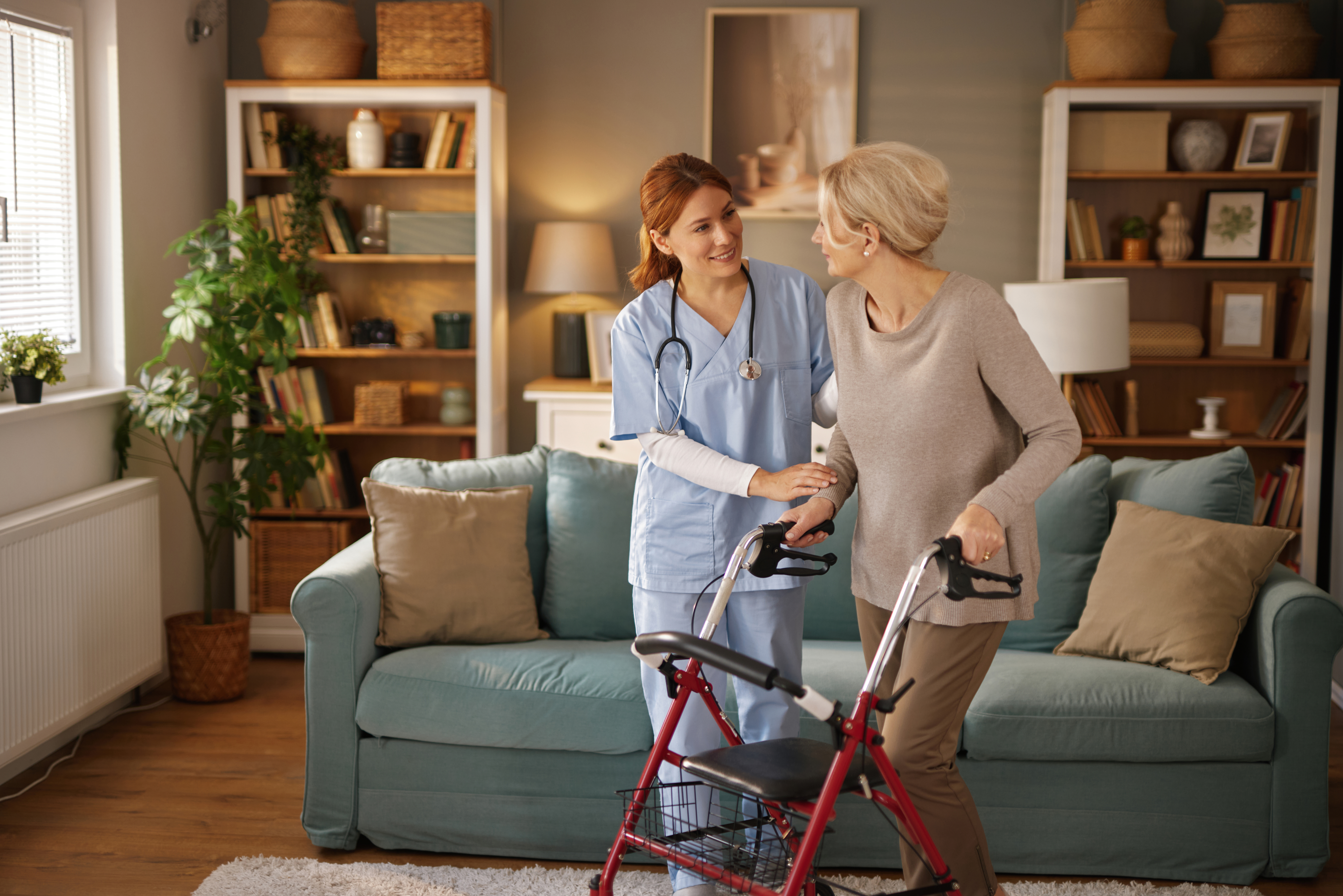 nurse assisting elderly woman using walker in livi e48c55c7911a117d7a78