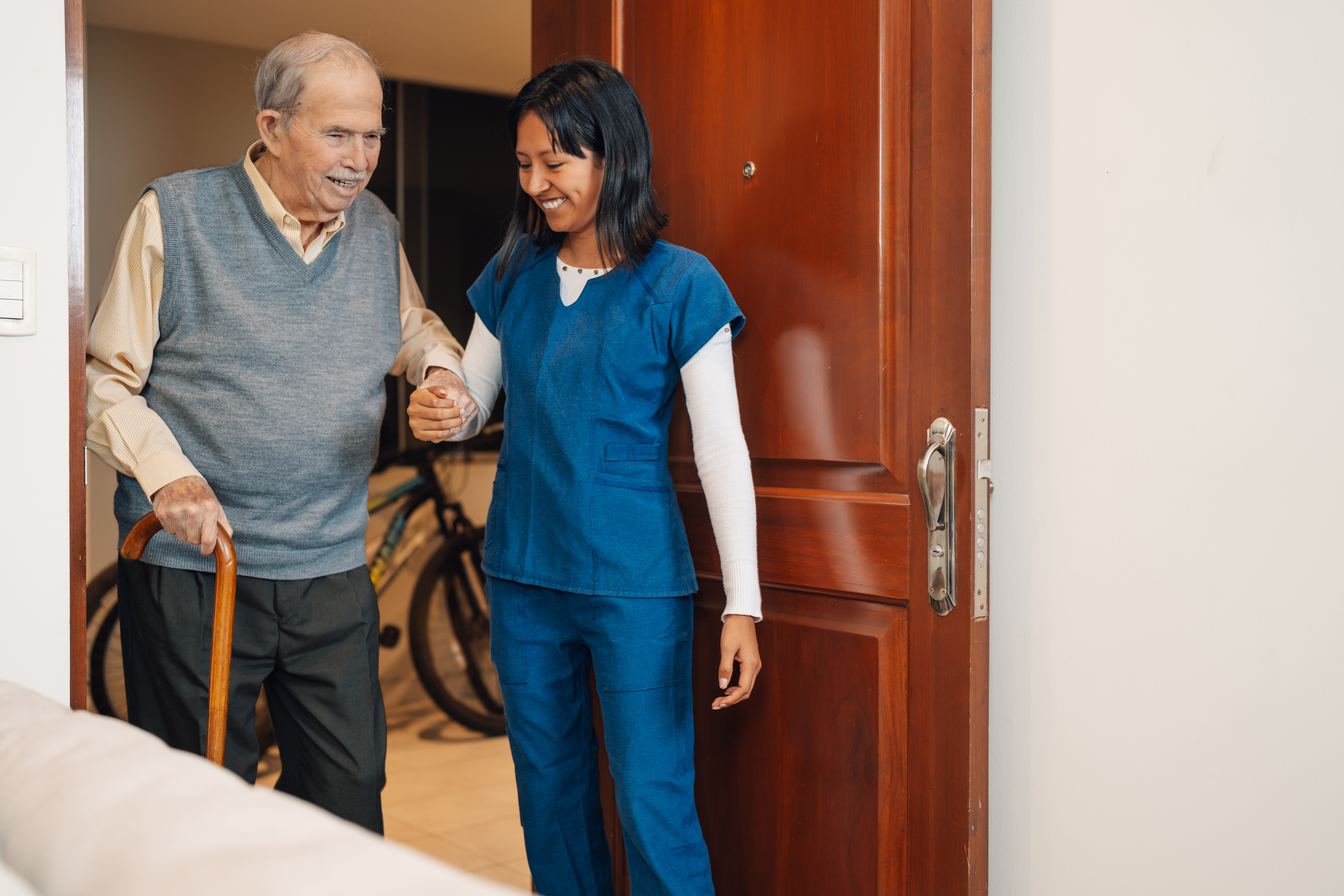 old man assisted by a nurse during a home visit 4584b115fa9f3b15a34a