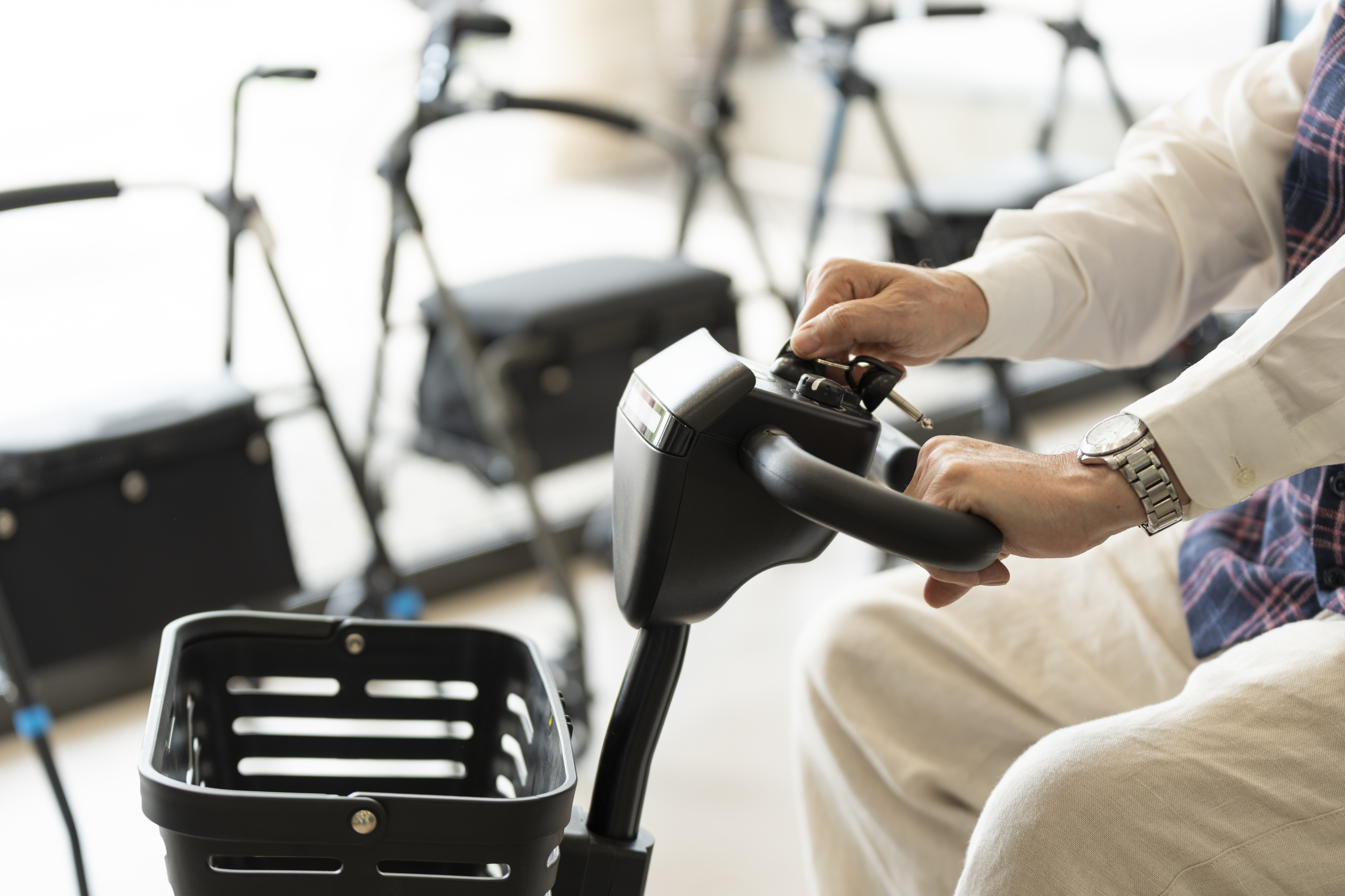 older man in an orthopedic shop trying out an elec ee0e07da237b96c92ebd