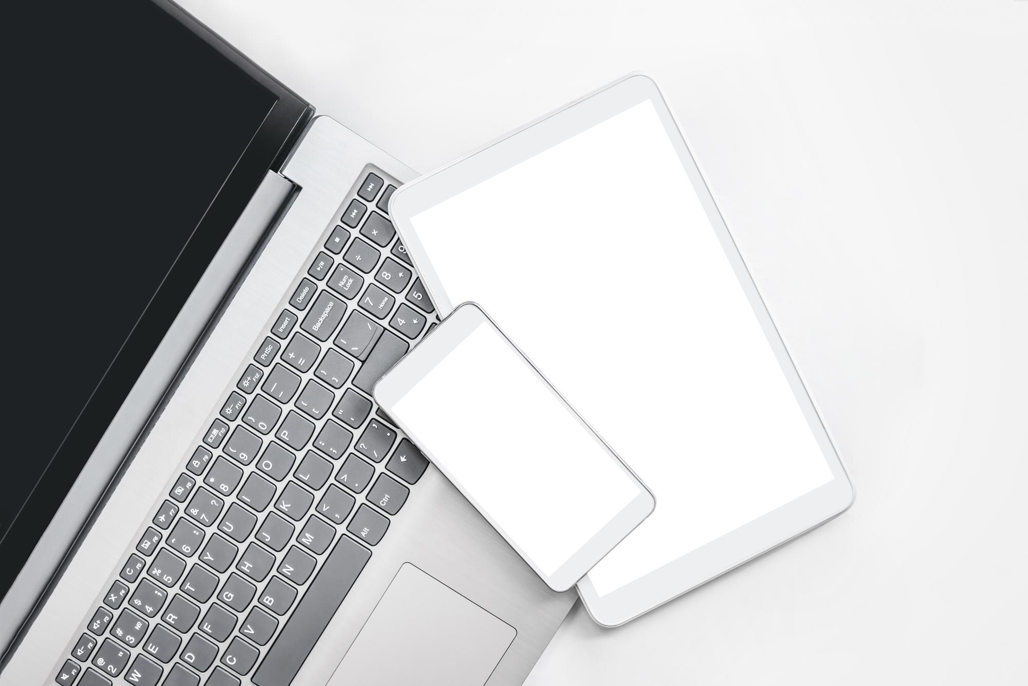 open grey laptop with white digital tablet and sma e4f304ca23e93235ac07