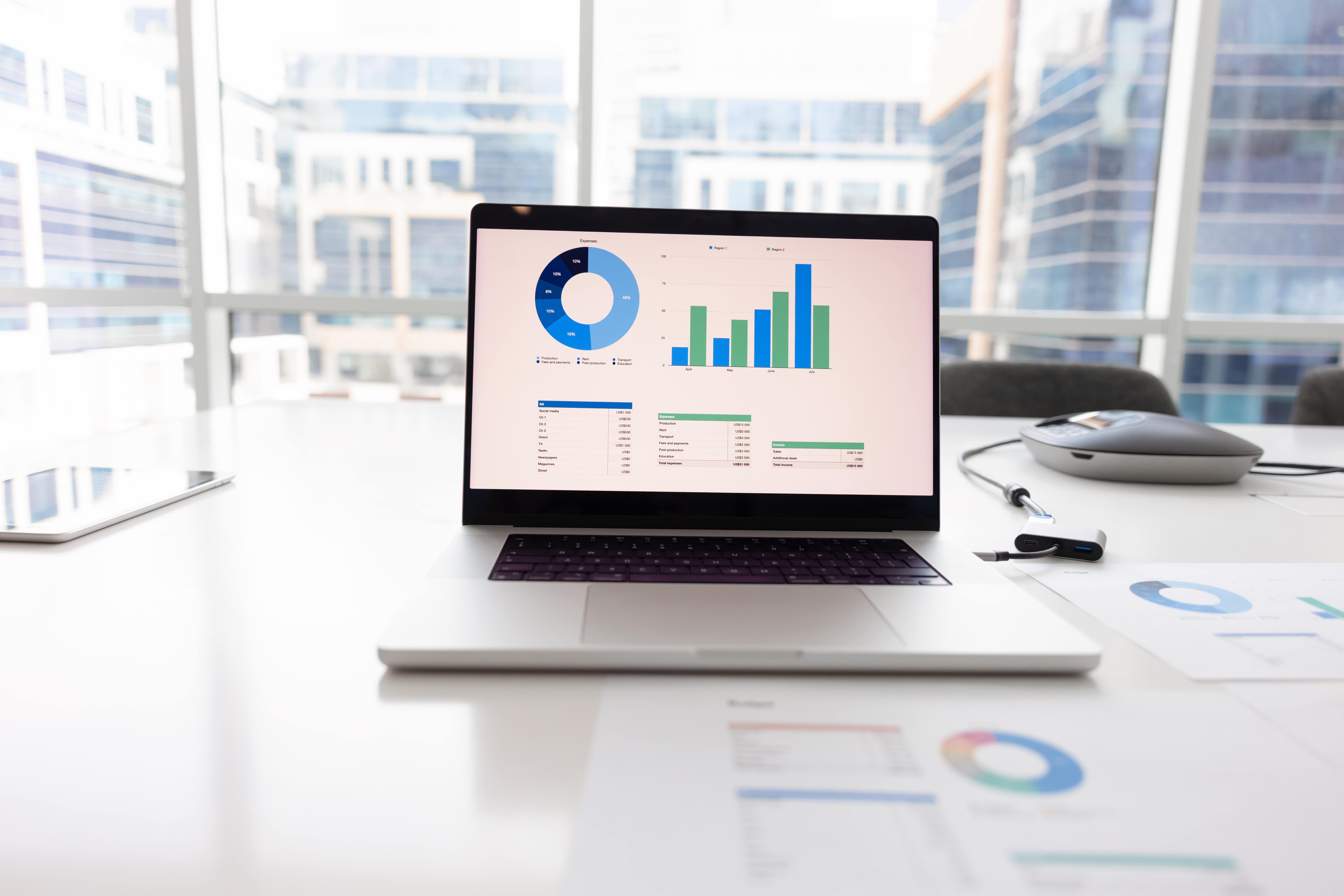 open laptop on workplace table with analytic diagr ec3aa3c1e39288e9a85c
