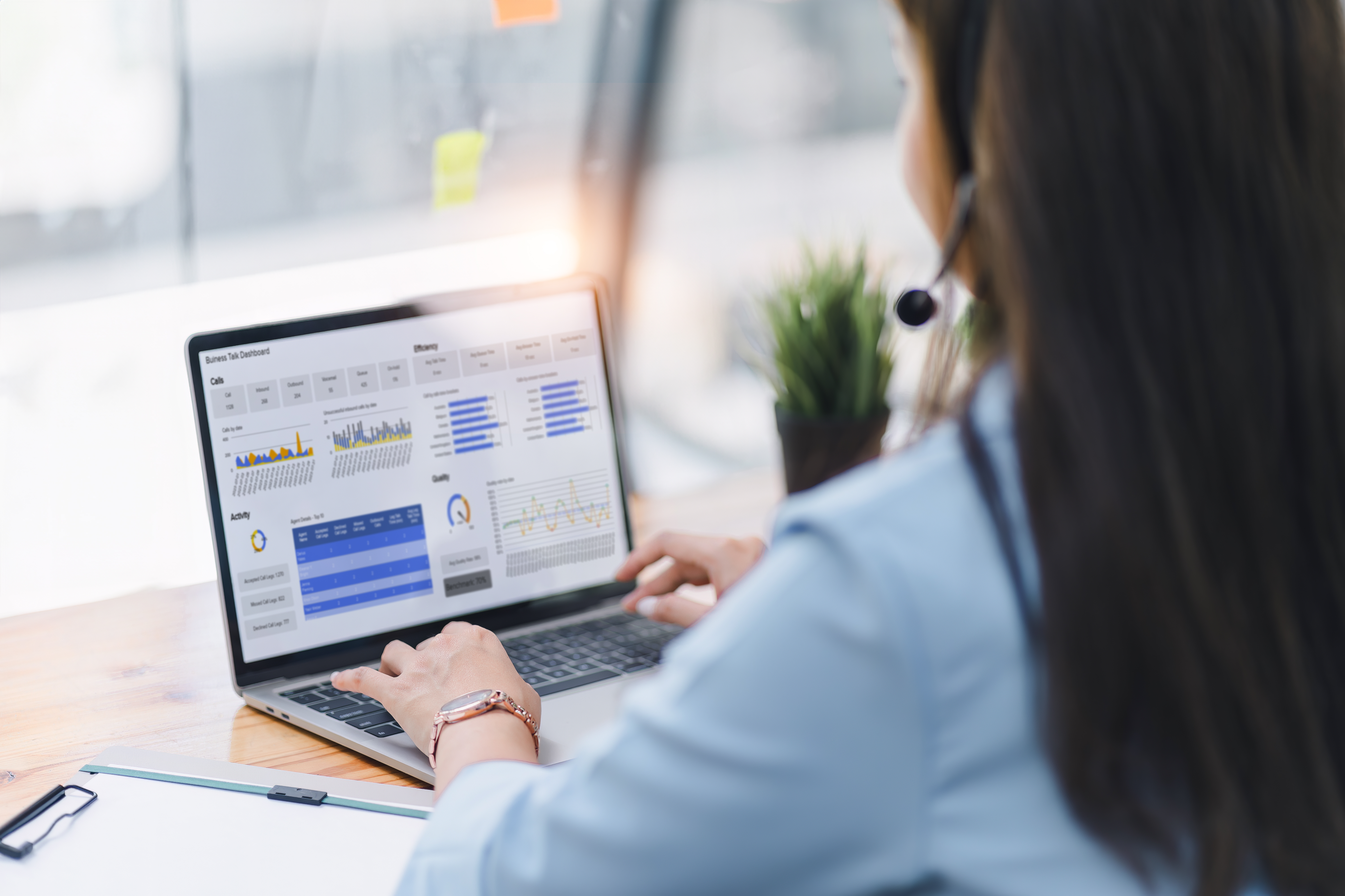 operator wearing a headset using a dashboard on l 4b7f97a9d79145d50880