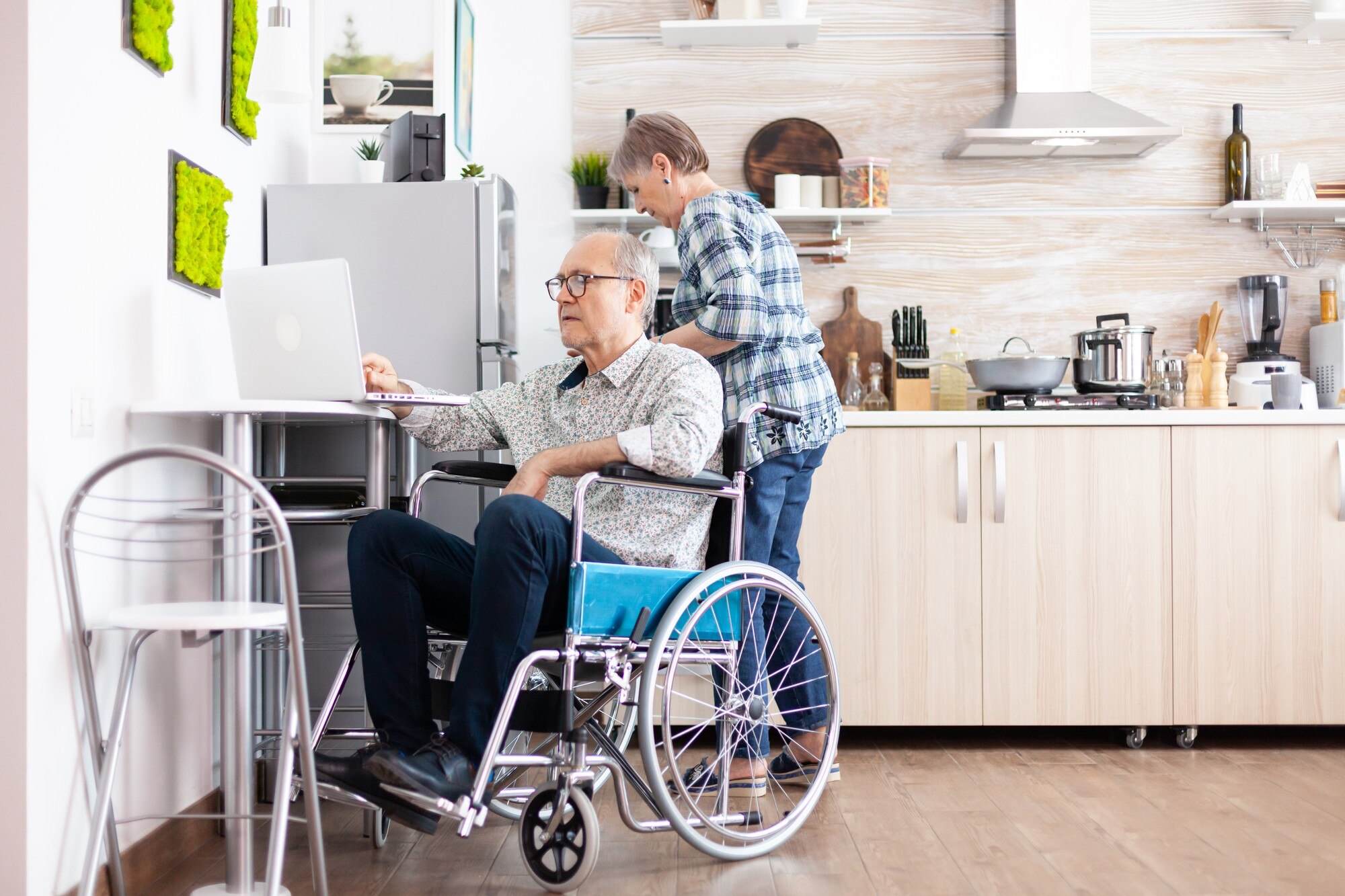 paralysed elderly man in wheelchair typing on lapt 4234241280f7e8fcf438