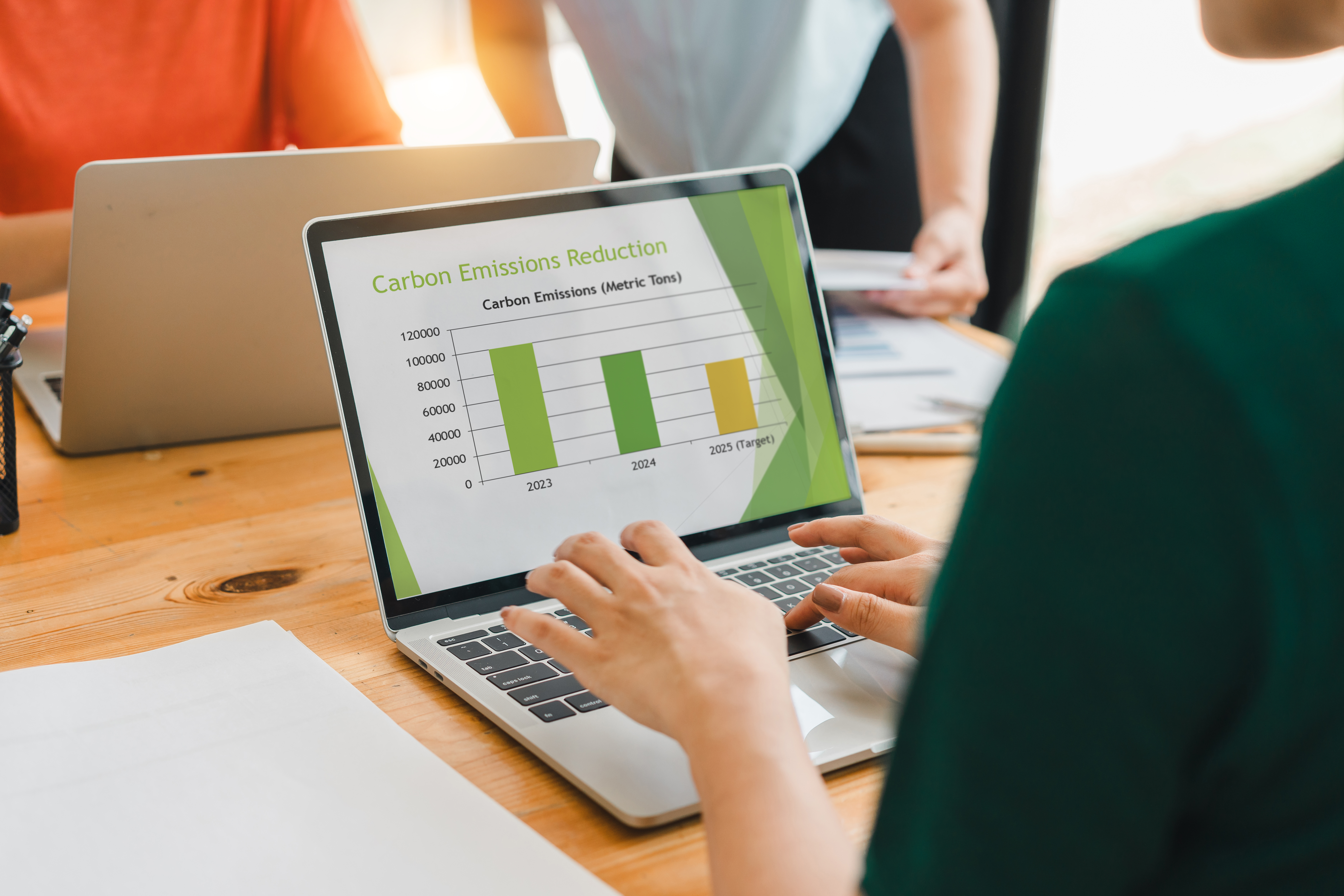 person analyzing carbon emissions reduction chart 020a33bbe0f7d69ca949