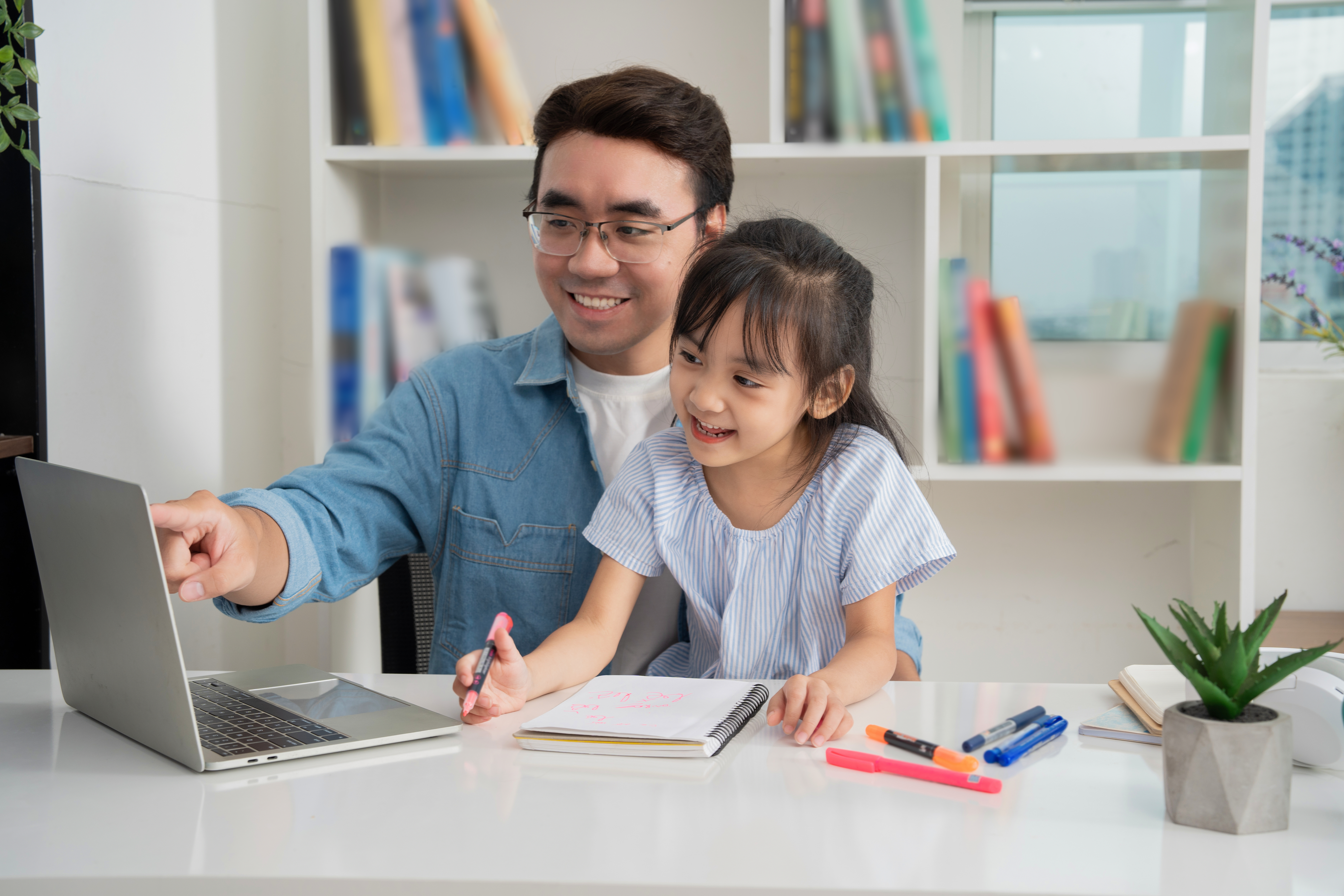 Photo Of Asian Father And Daughter Studying At Hom 7a9e31b46cab29cbcb94