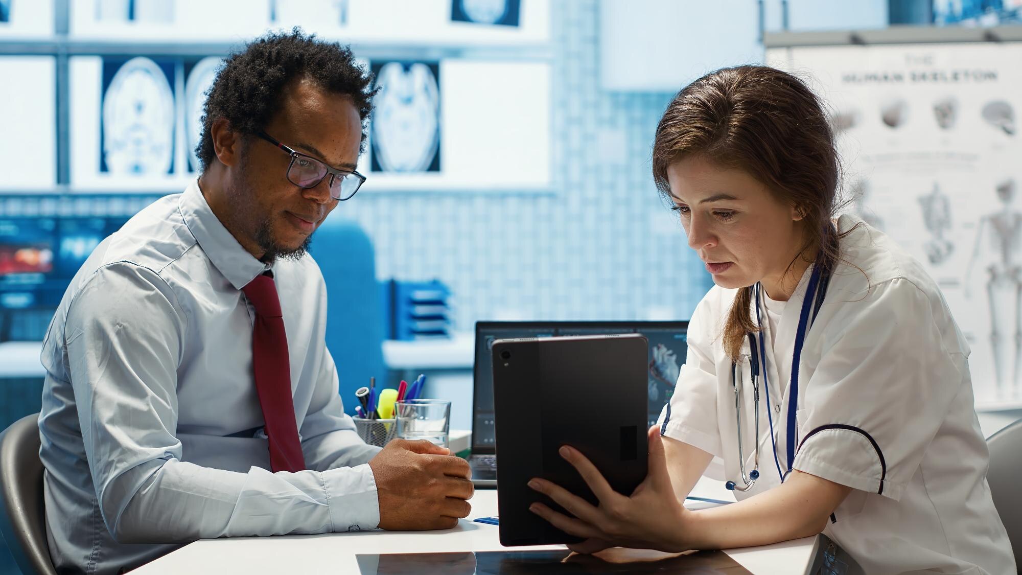 Healthcare consultant showing doctor plans for startup