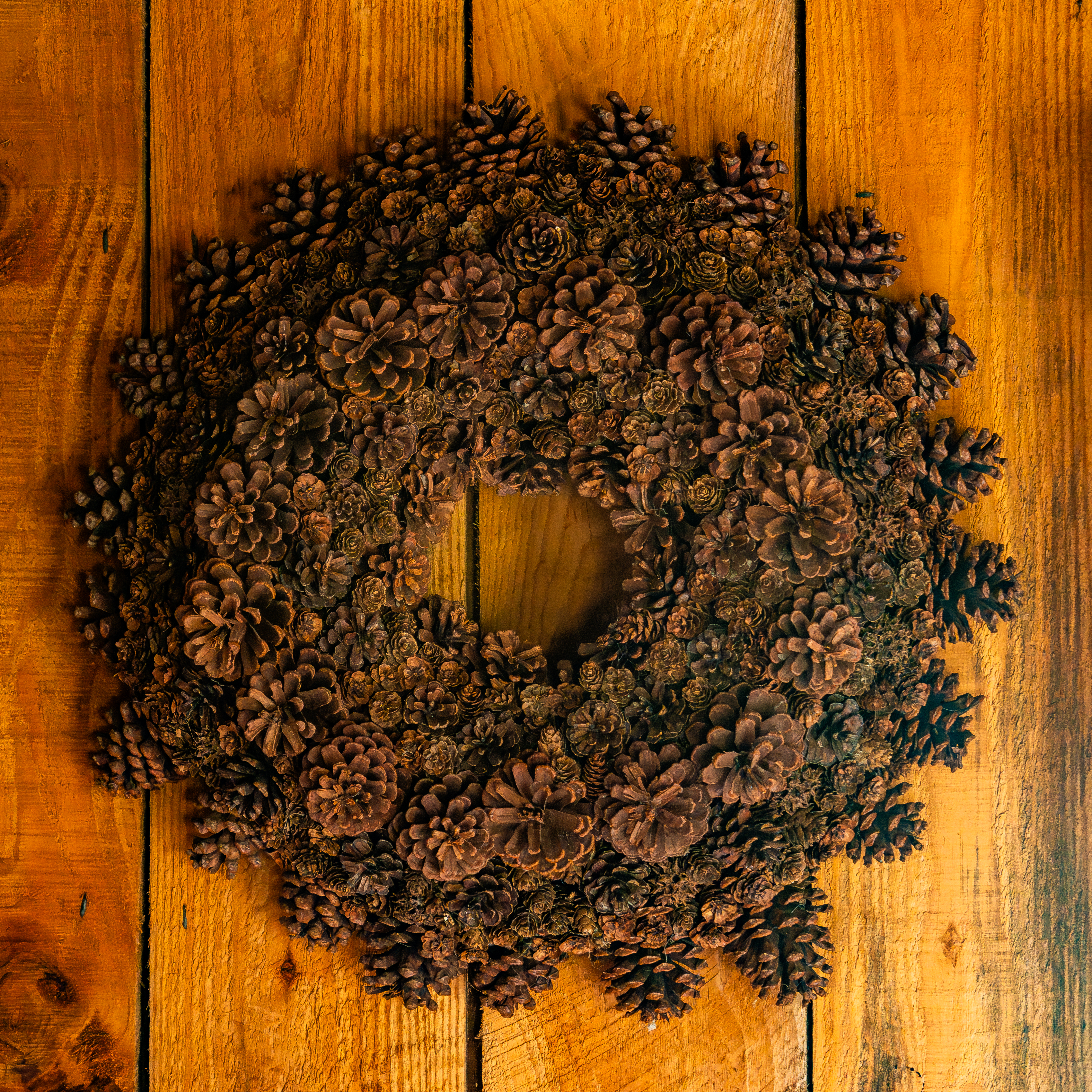 pinecone wreath on wooden table for seasonal decor e93ceae2a0489d6d1d60