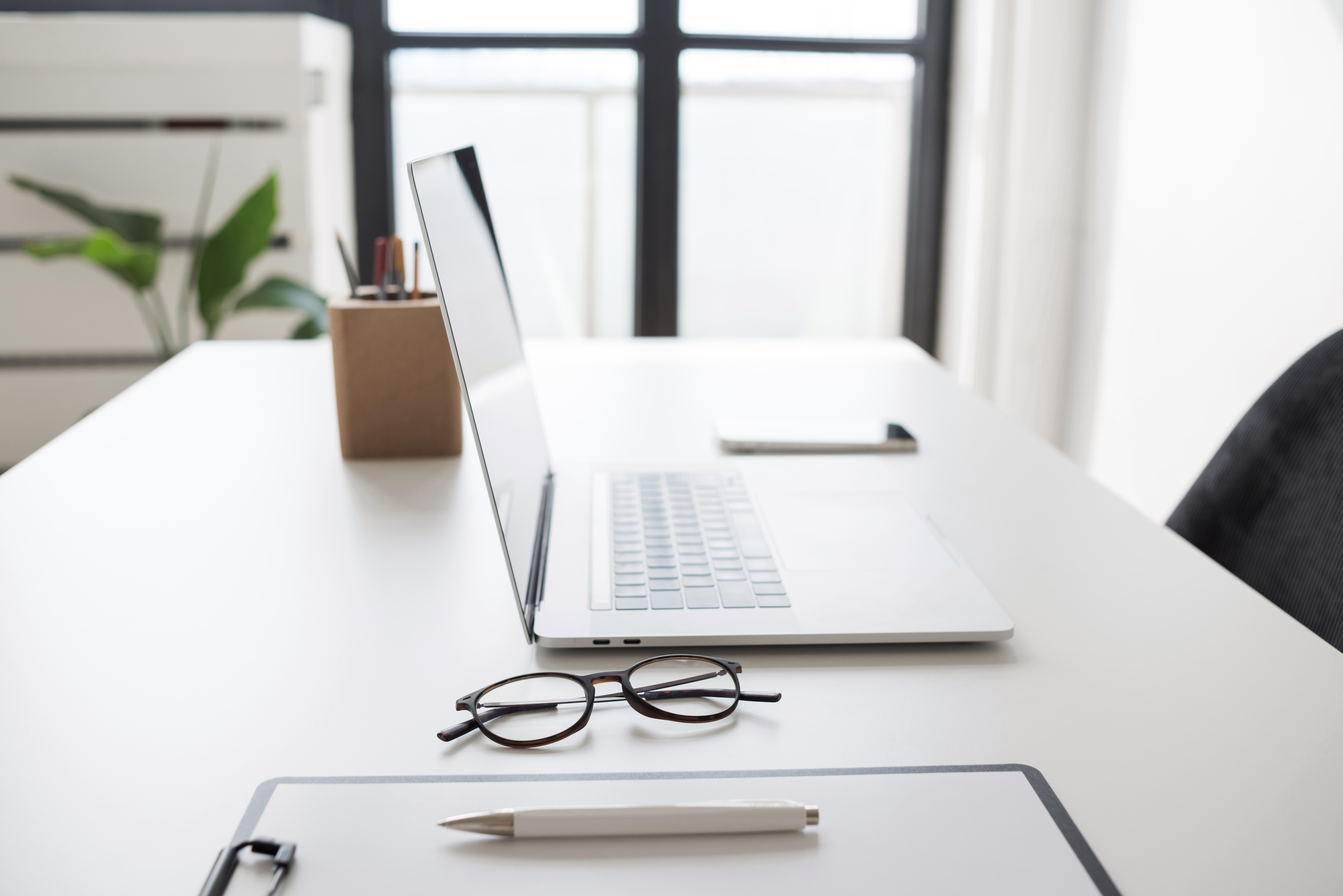 Crafting a Digital Transformation Strategy Aligned with Your Business Objectives 4 place of work in office laptop computer glasses a9161d38ec4c53e823d1