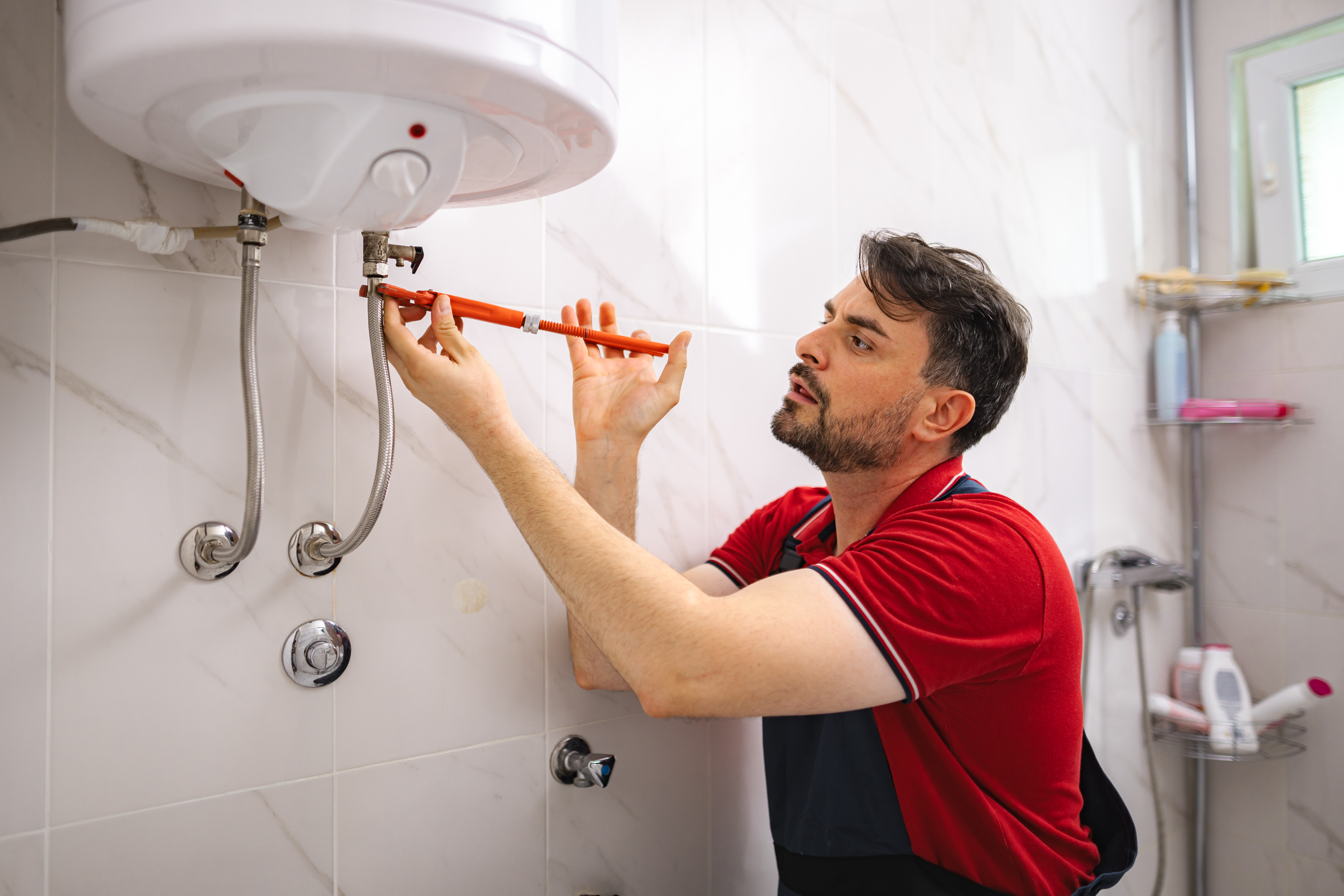 man fixing water heater problems