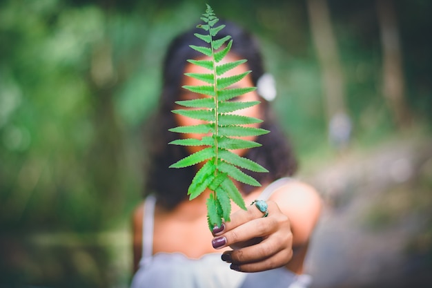 Celebrating Cannabis Awareness Milestones: A Journey of Growth and Learning 1 portrait beautiful asian woman holding green leaf front her face enjoy natural outdoor 40836 1063 6aed63f5ada55e799514