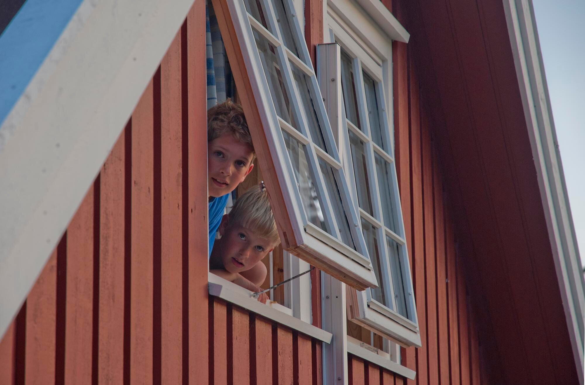 Winter Home Improvement Ideas with Cut‑to‑Size Plastic Sheets and Panels 2 portrait of brothers peeking through window of hou 7ce1469fb7fa7f795a0d