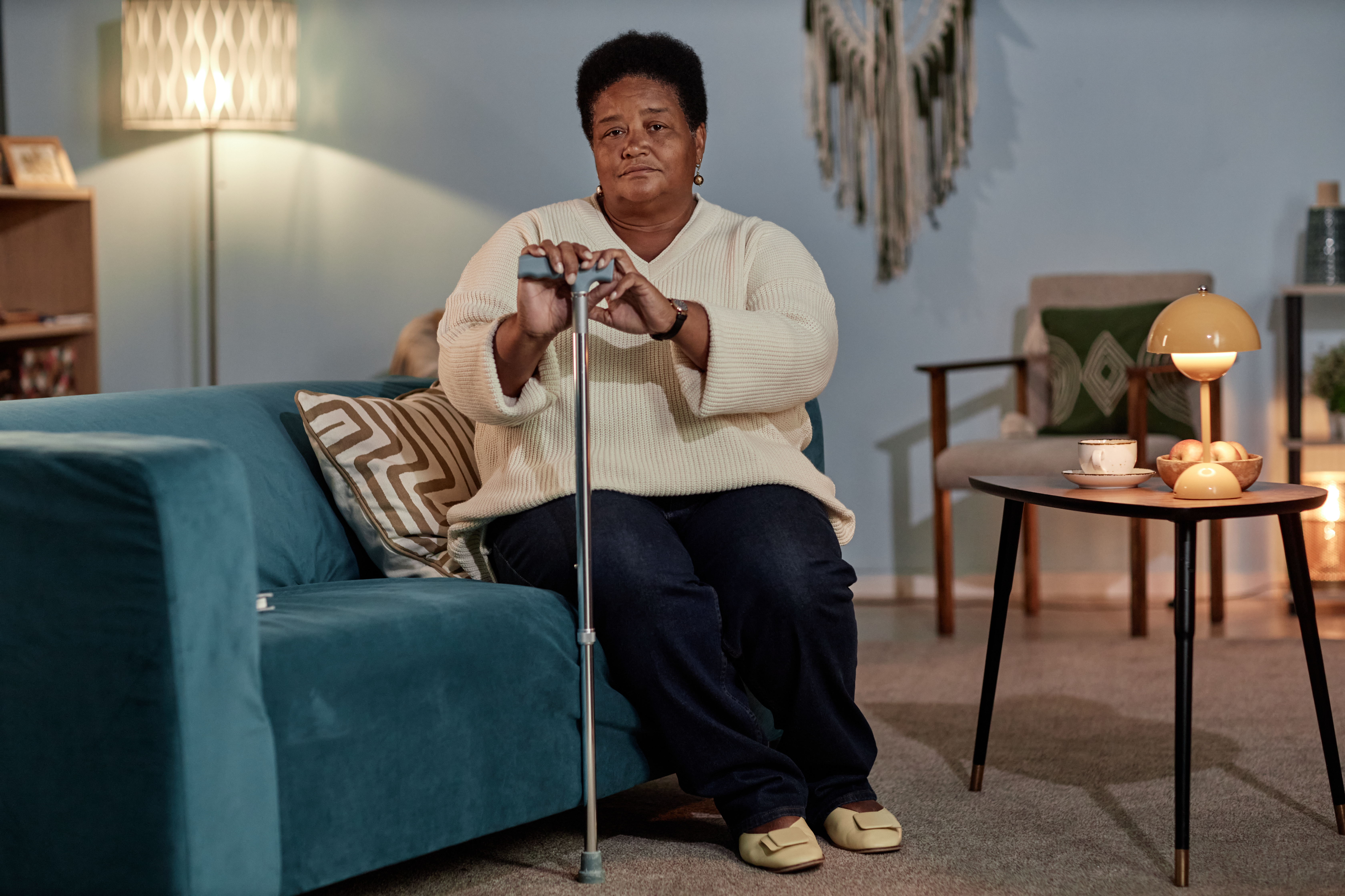 portrait of senior black woman holding walking sti a55b81c51347aa28032f
