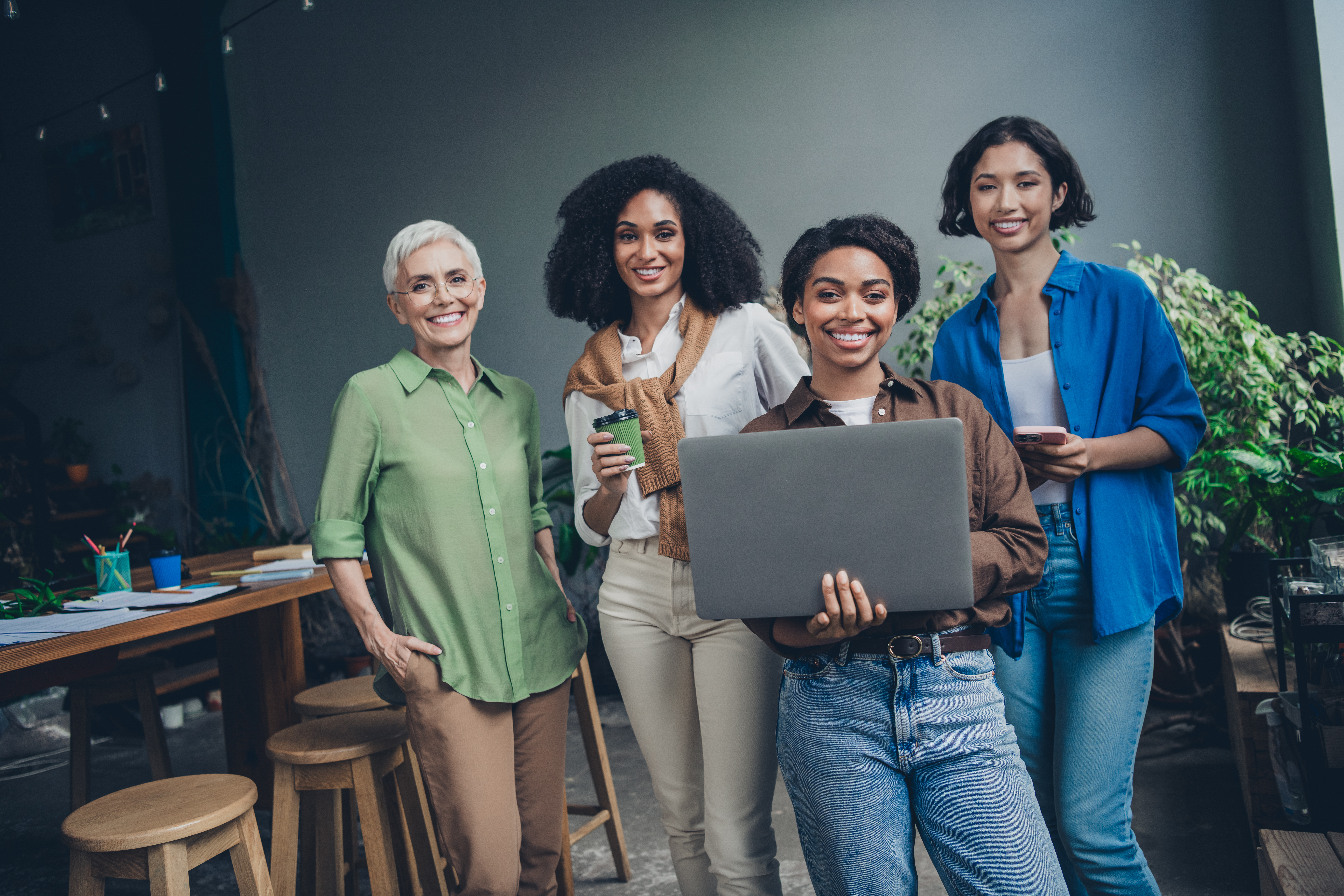 Why Community Support is the Secret Sauce for Women Entrepreneurs in Travel 2 portrait of team ambitious business women laptop c 4929b07ba924e44a8aef