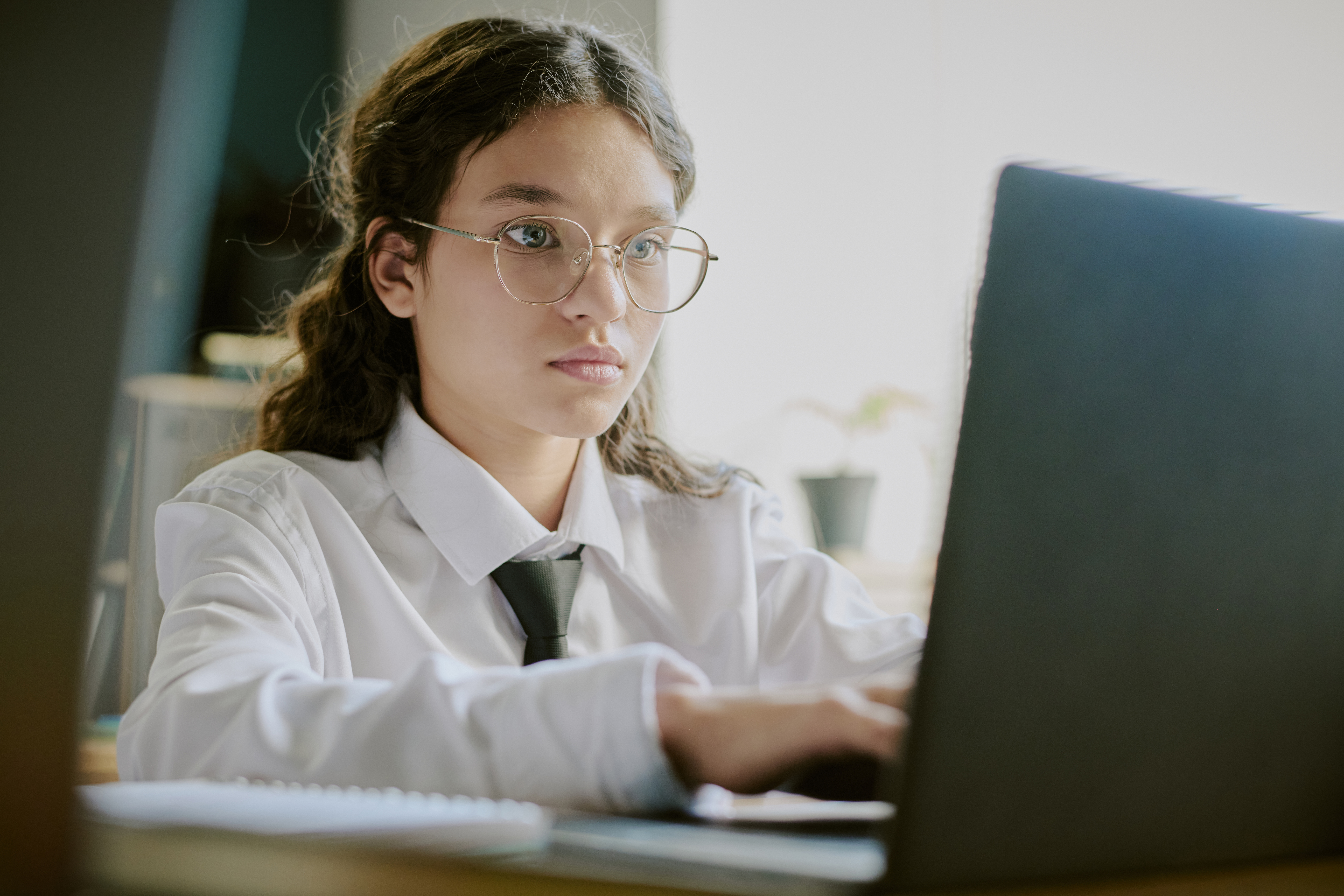 Portrait Of Young Student Working On Laptop In Cla 797a6b003eb74866ca9d