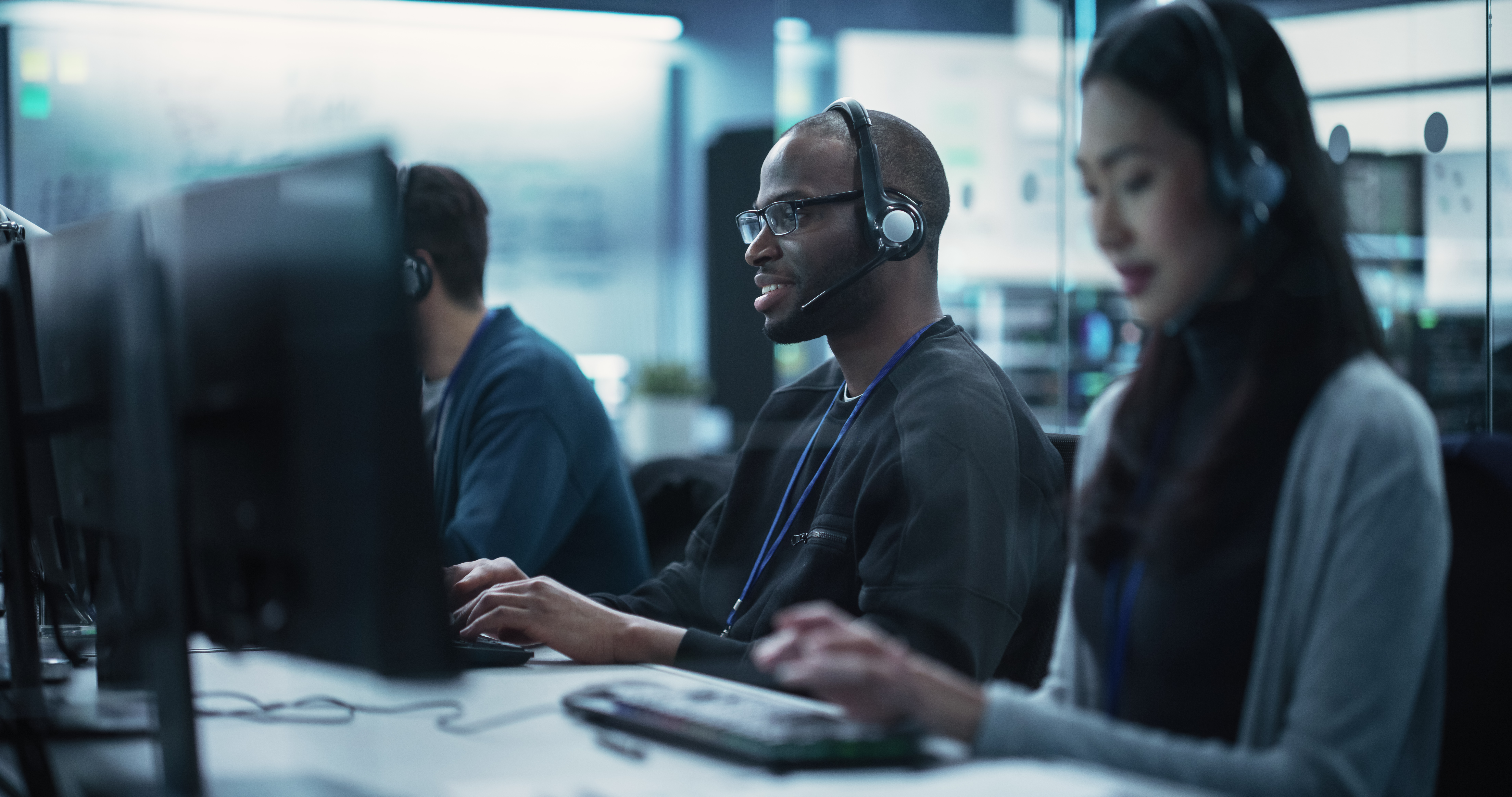 positive technical support manager talking on a ca 2197a69d6d53a5f3d301