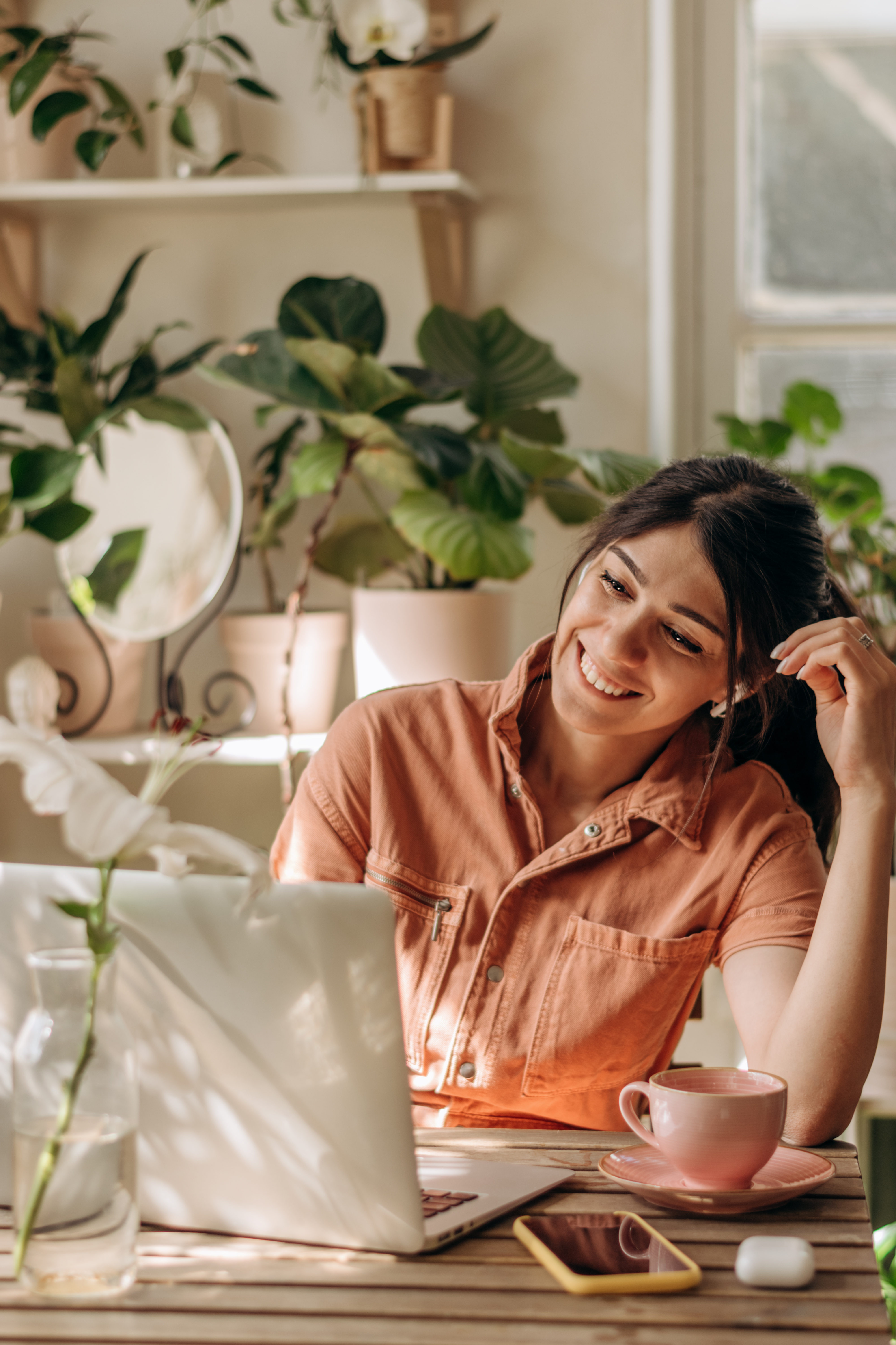 positive young woman using a laptop at home video 1206f0f62430282920c6